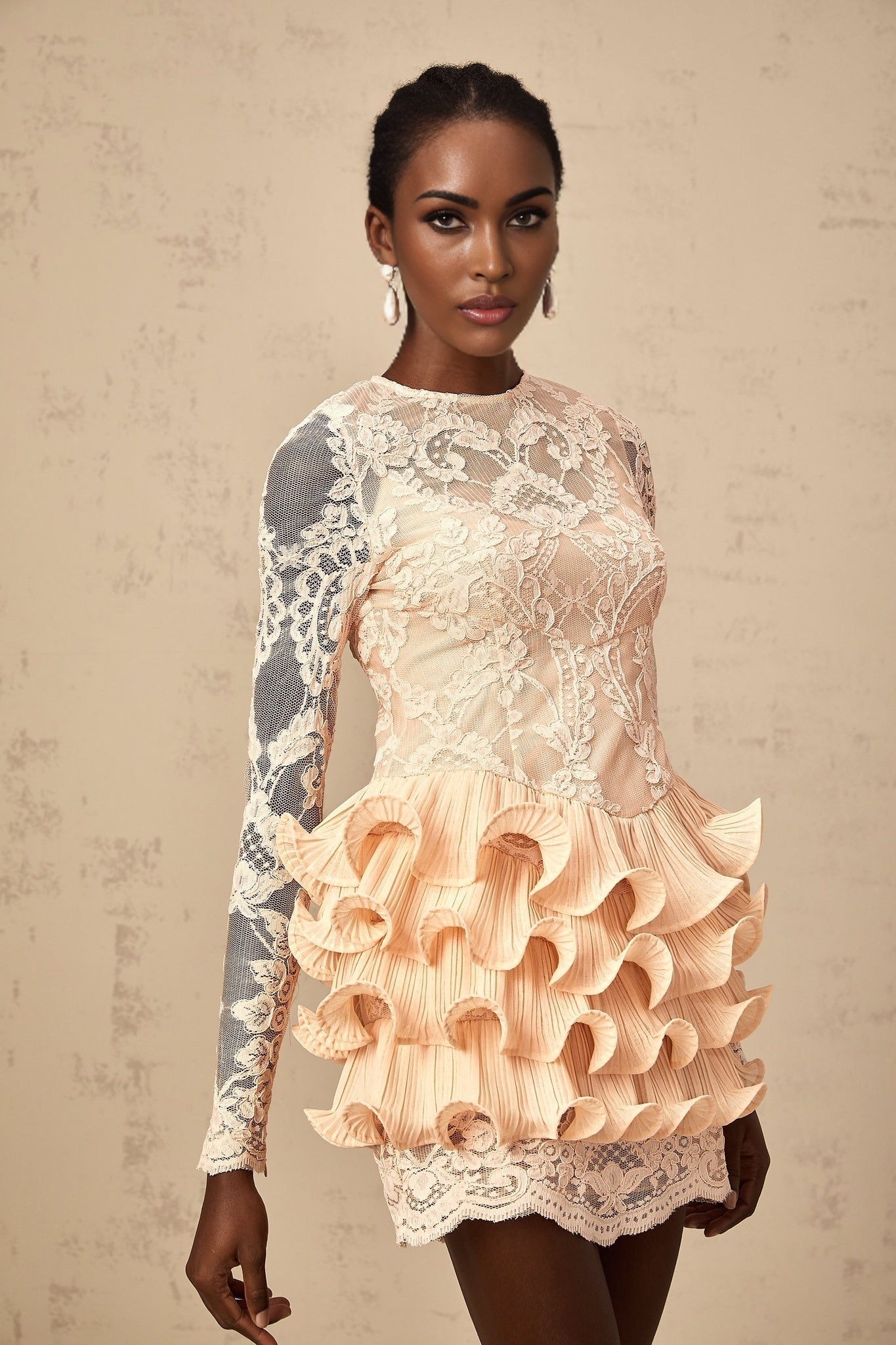 A short tiered mini dress with floral lace panels and a feminine design named Irene