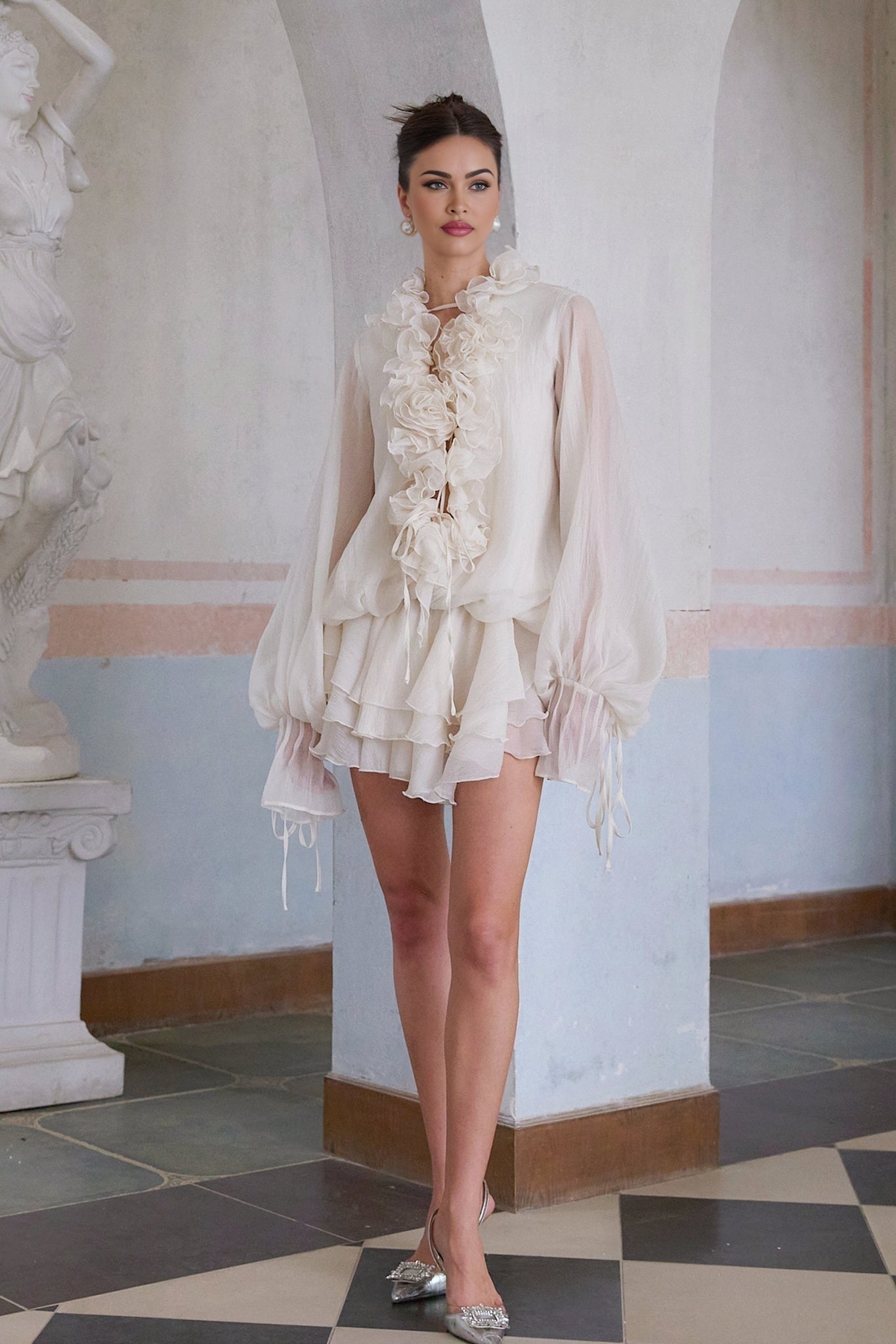 A short tiered neutral mini dress with floral applique details called Zephyrine