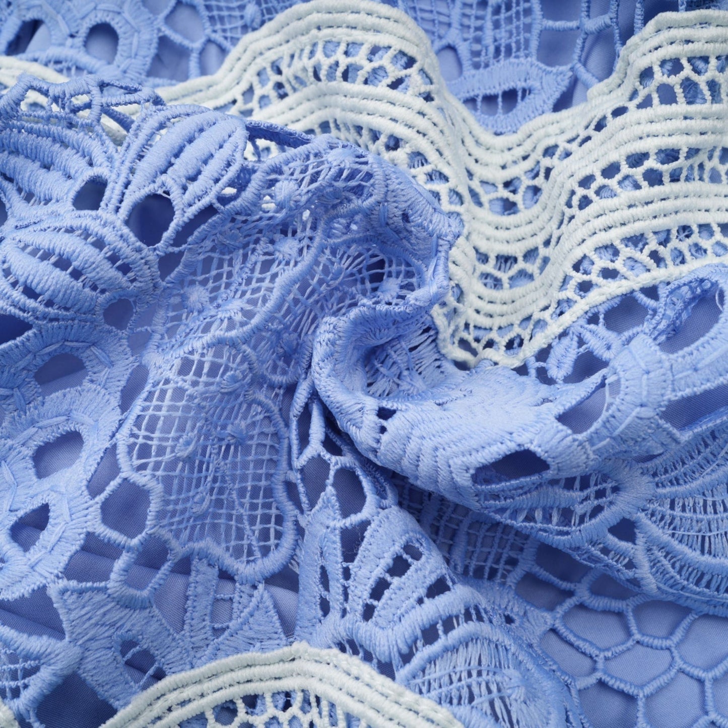 A short white mini dress with a Vneck and colorful floral embroidery featuring a fitted bodice and flared skirt