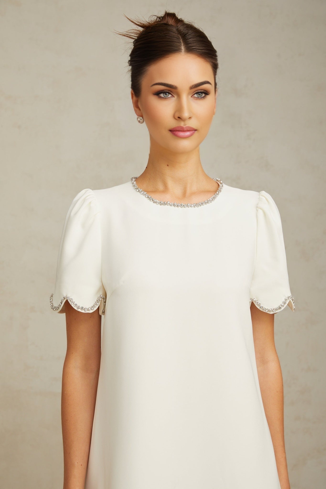 A short white mini dress with crystal embellishments named Berenice