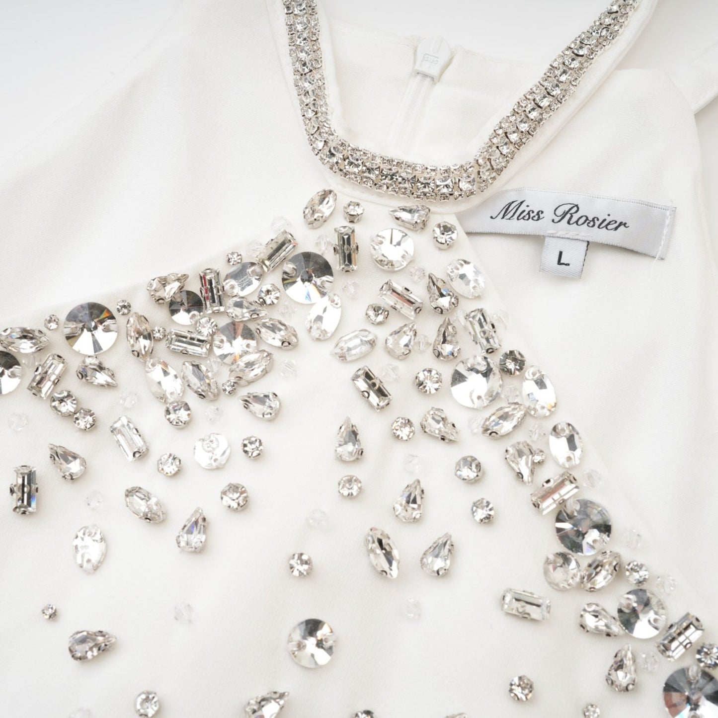 A short white mini dress with embellishments named Xanthea