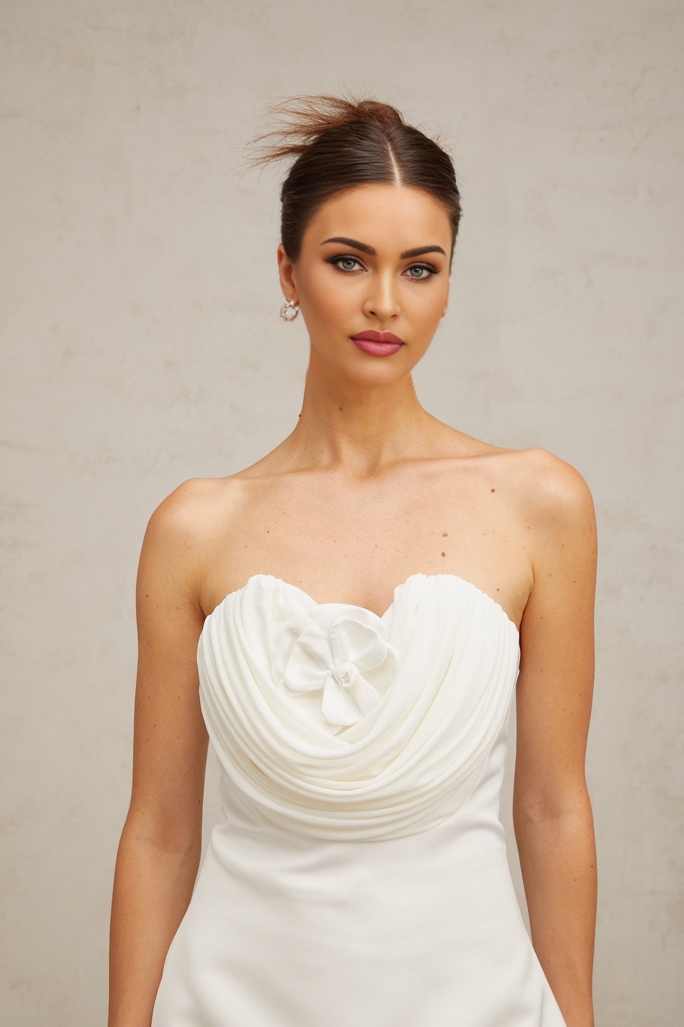 A short white mini dress with floral applique details named Lucie