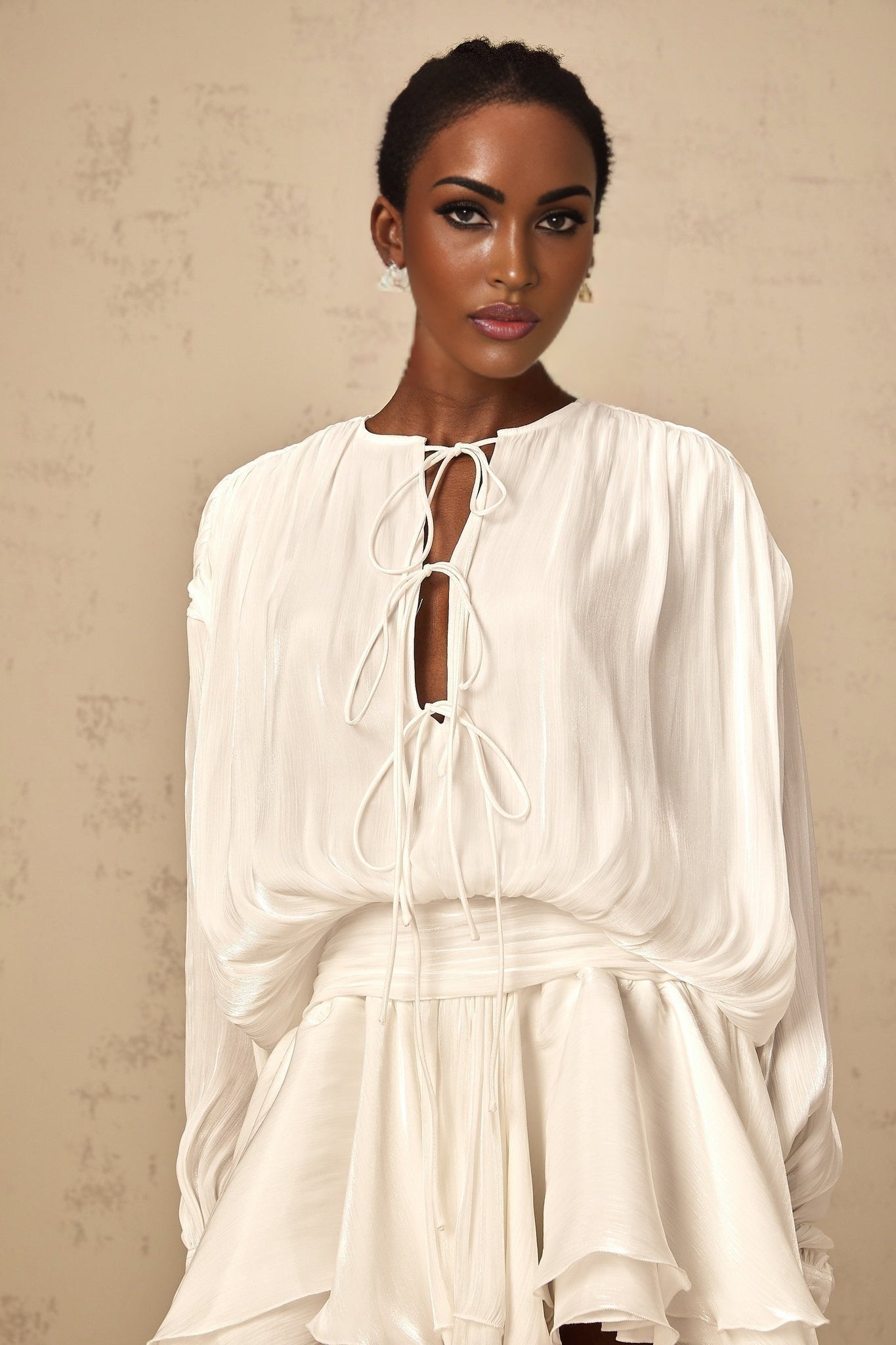 A short white pleated mini dress with a glittery effect named Mahault