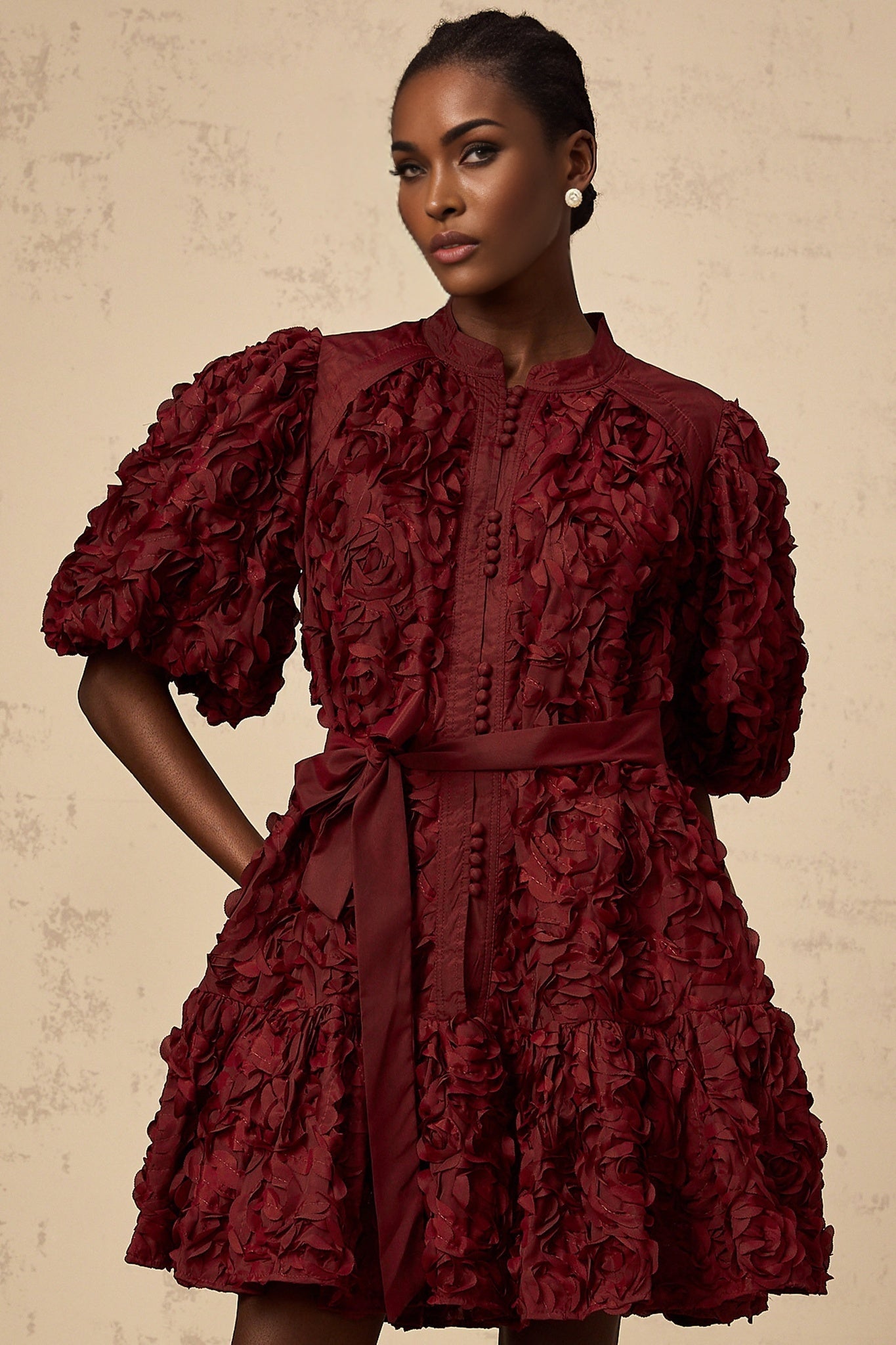 A short winered mini dress with 3D petal puff details named Segolene