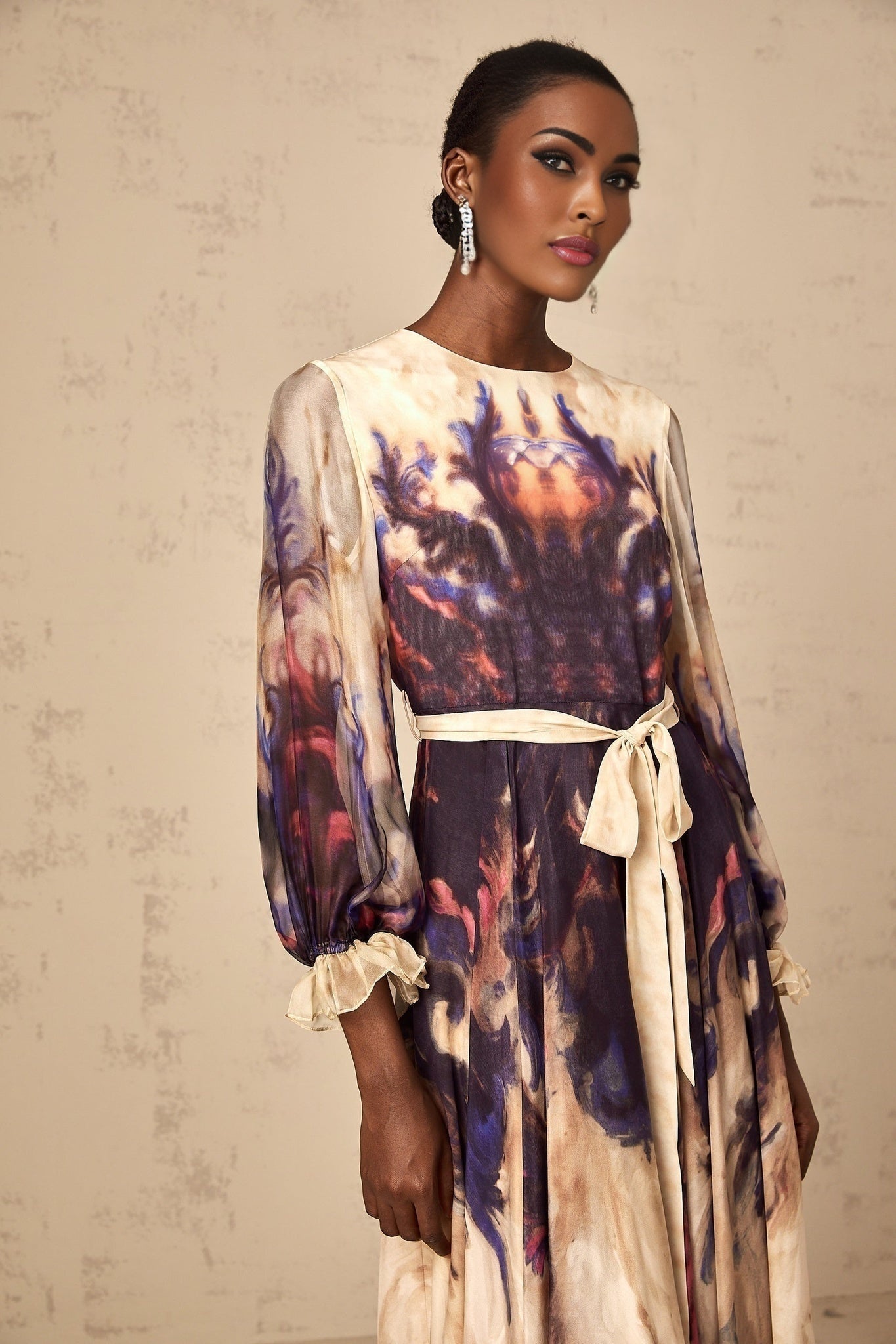 A silk midi dress with a smudged graffiti print design in an urban style