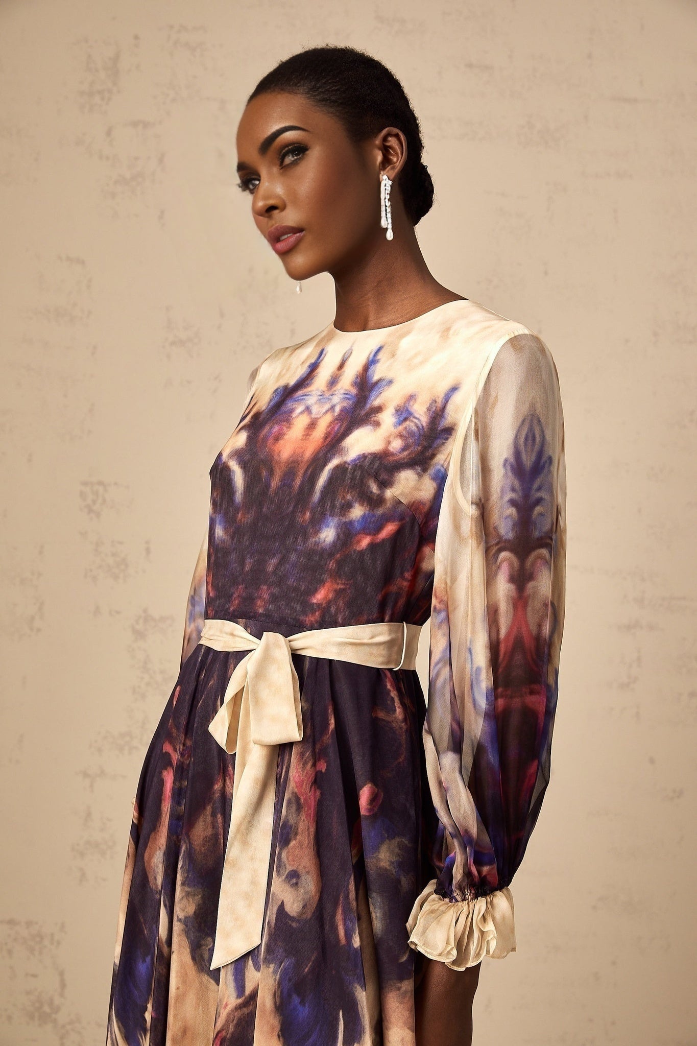 A silk midi dress with a smudged graffiti print design in an urban style