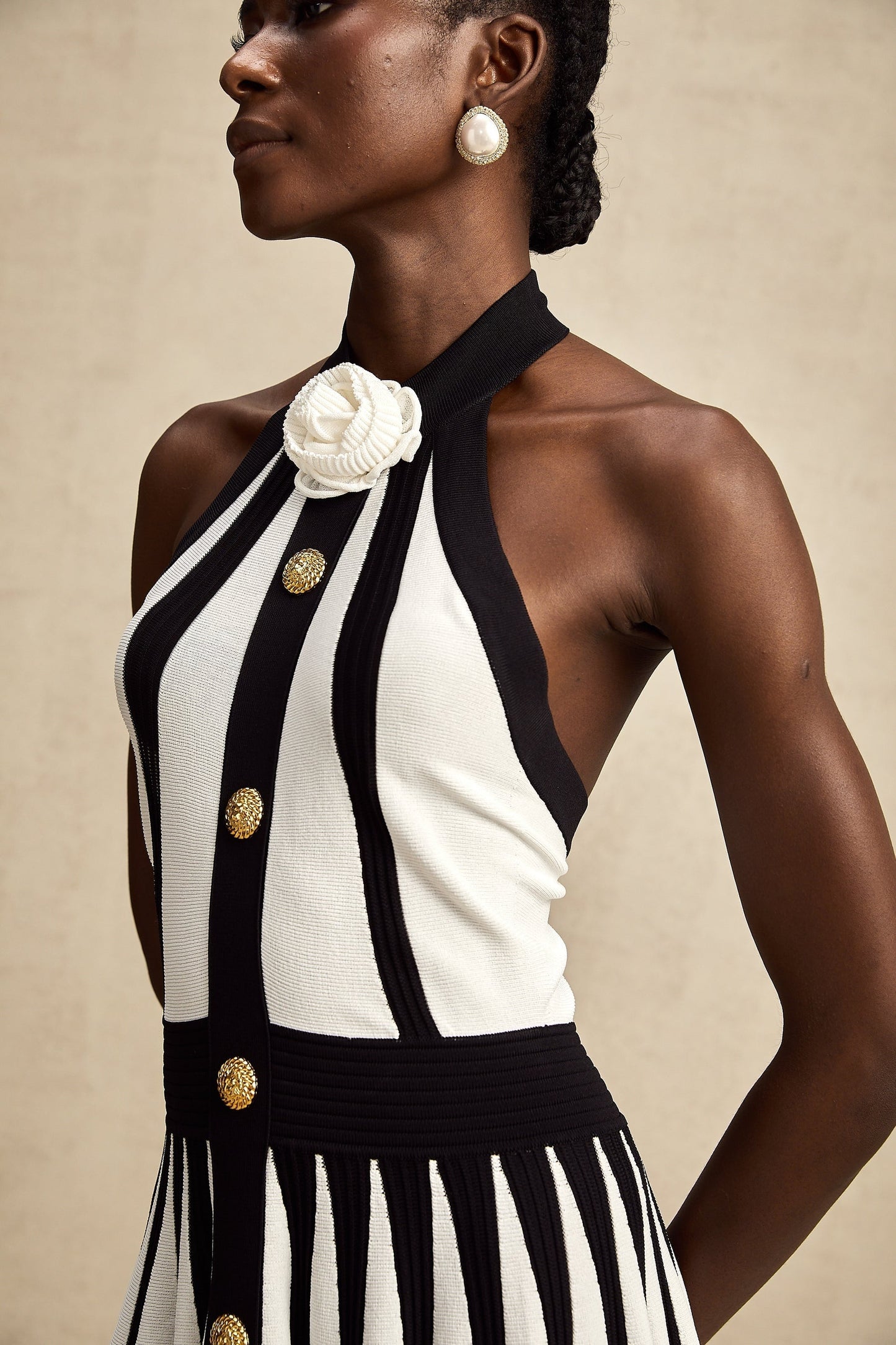 A sleeveless knitted mini dress with contrasting colors named Celeste