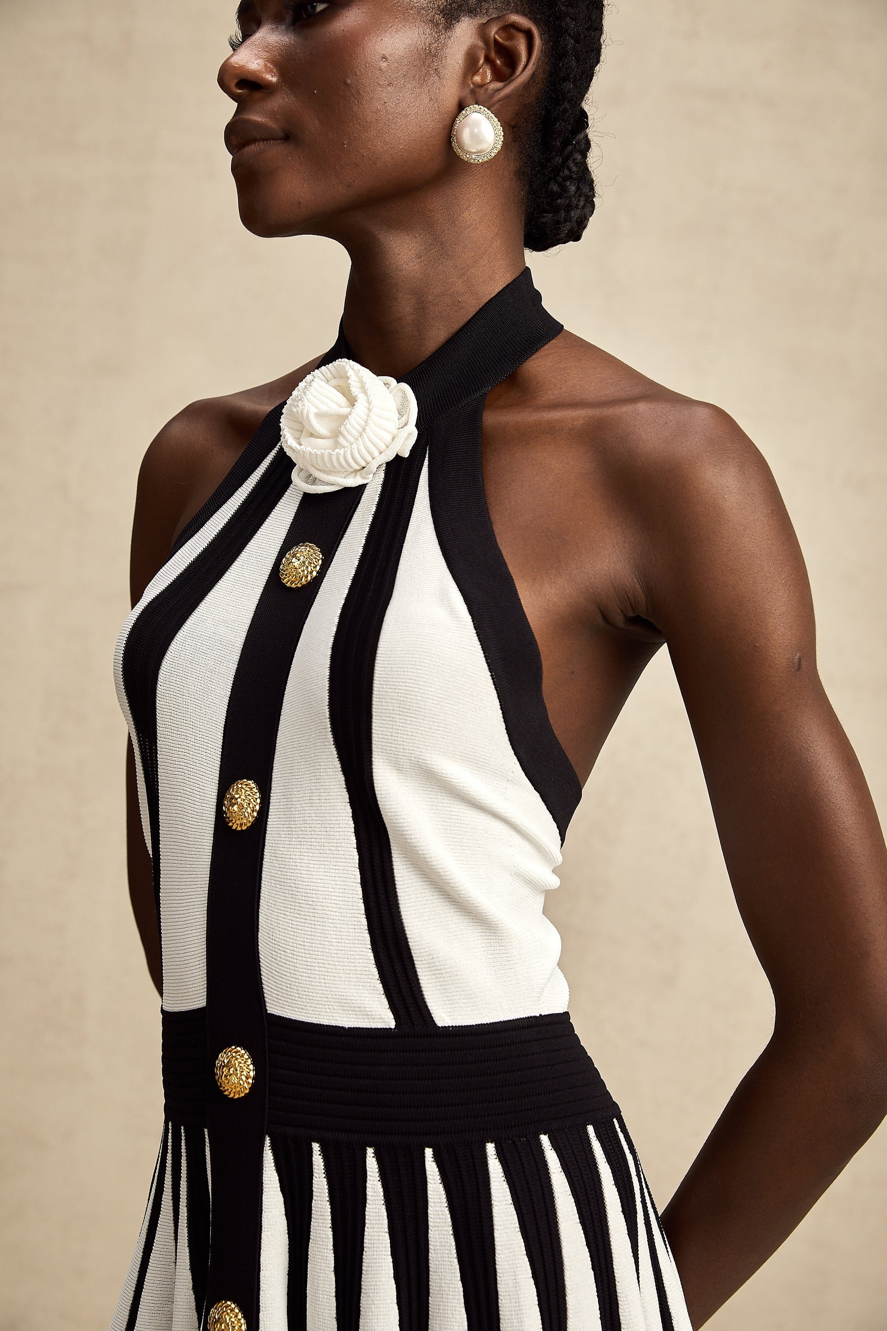 A sleeveless knitted mini dress with contrasting colors named Celeste