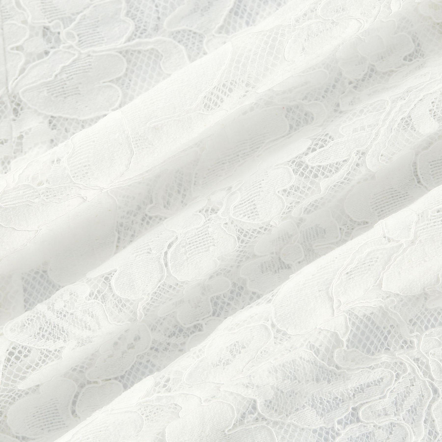 A sleeveless lace midi dress by Celine featuring cutout details and a feminine silhouette