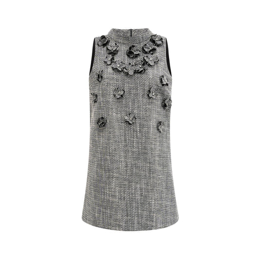 A sleeveless mini dress with a floral pattern featuring faux flowers named Nadege