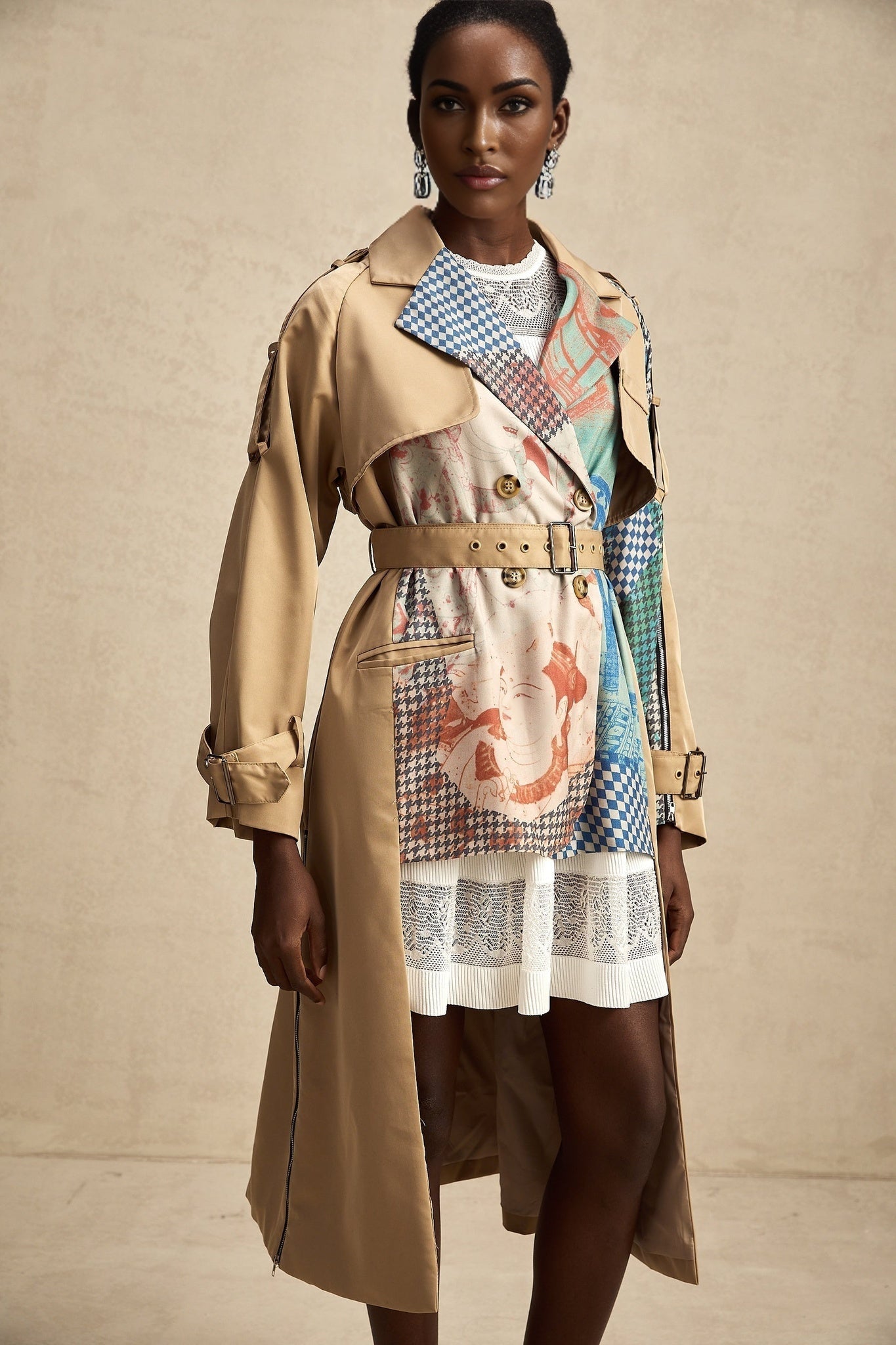 A trench coat with contrasting colors and a printed design featuring a belt at the waist named Josephine