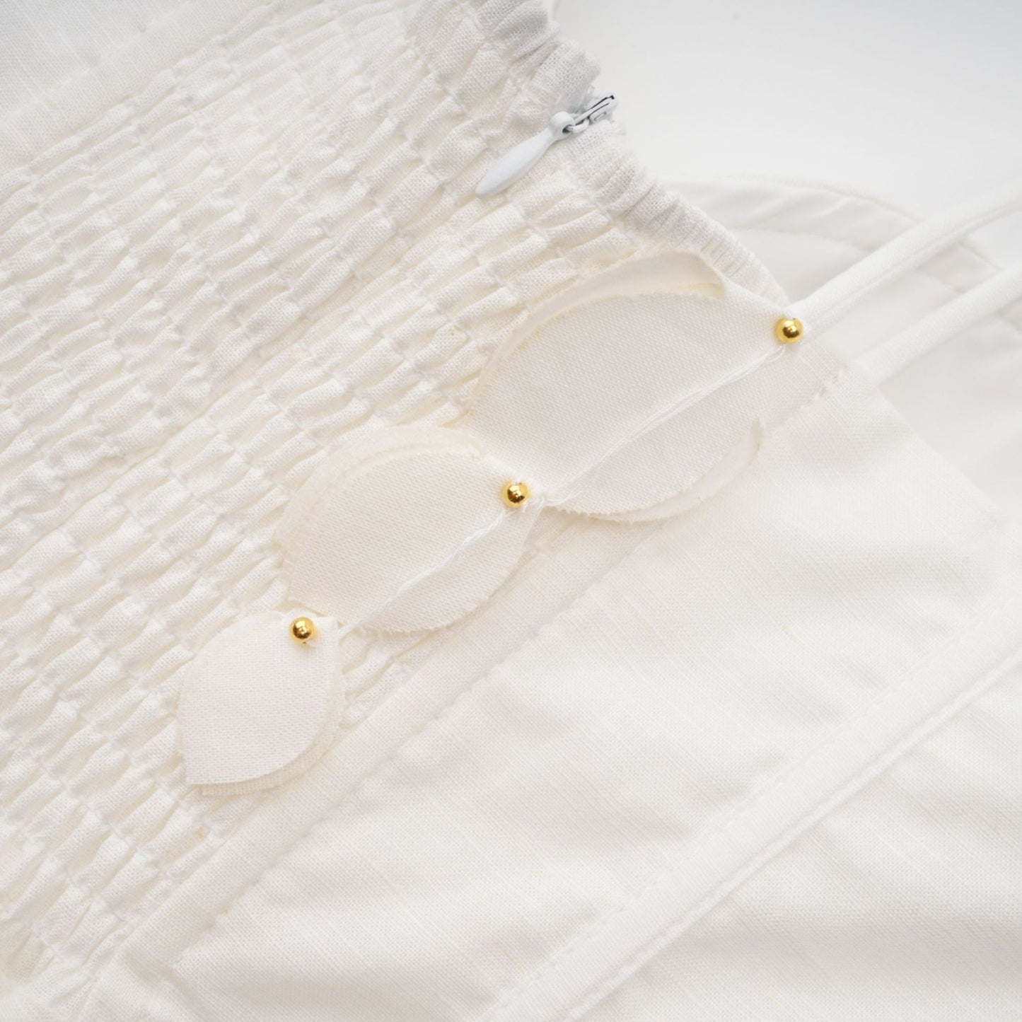 A white corsetstyle midi dress with a fitted bodice and flared skirt named Helene