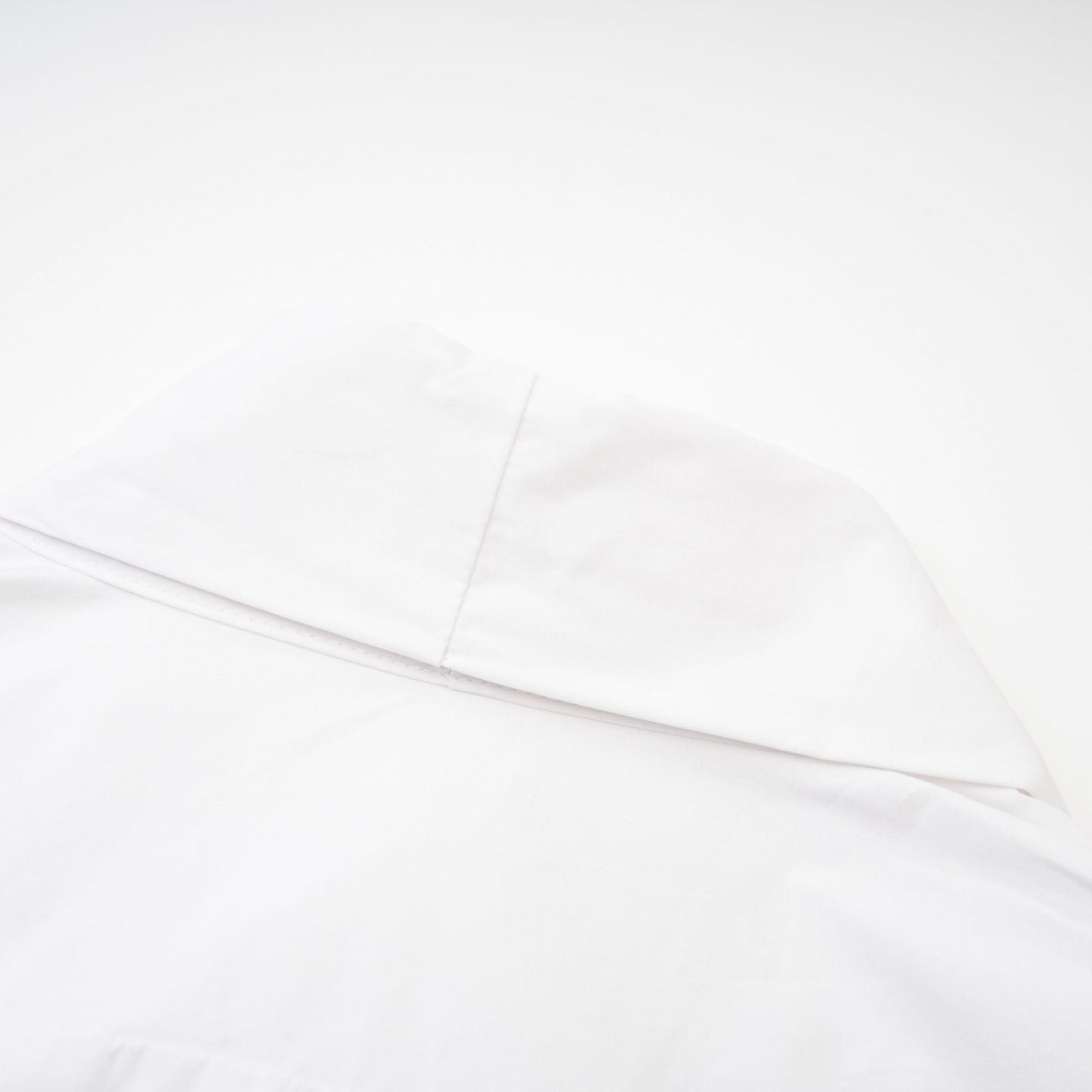 A white cotton shirt with a tie front design named Solene