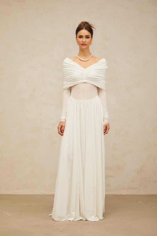 A white floorlength maxi dress with draped details and ruching featuring a sleek silhouette and elegant design