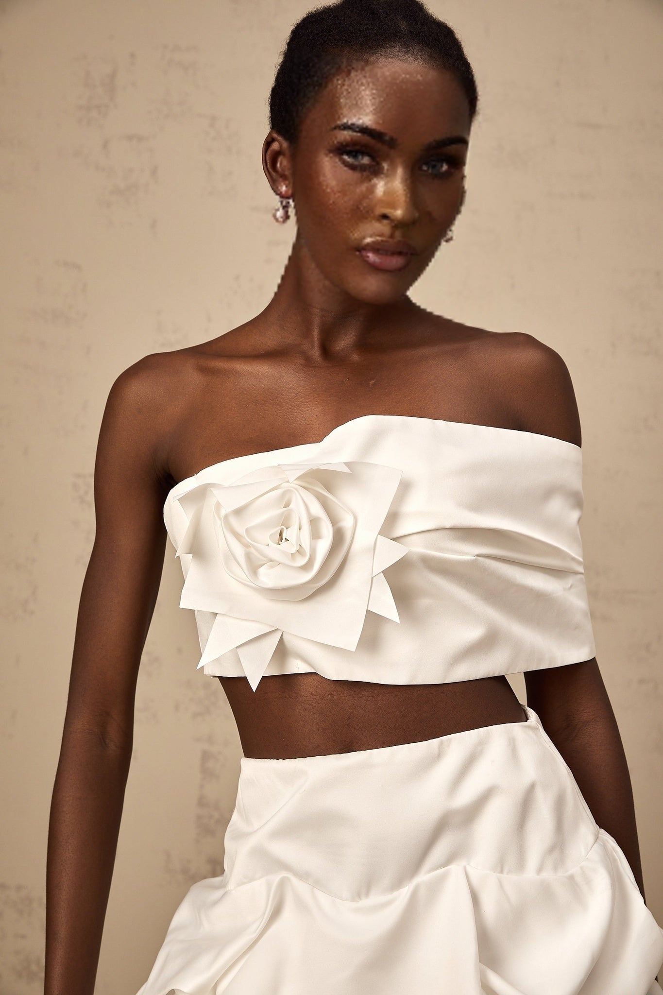 A white floral printed matching set featuring a pleated top and skirt from Honorine with delicate patterns and feminine design