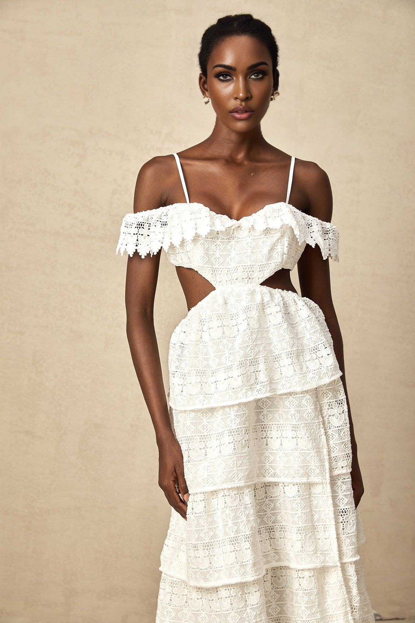 A white lace midi dress with an openwork pattern and delicate details named Genevieve