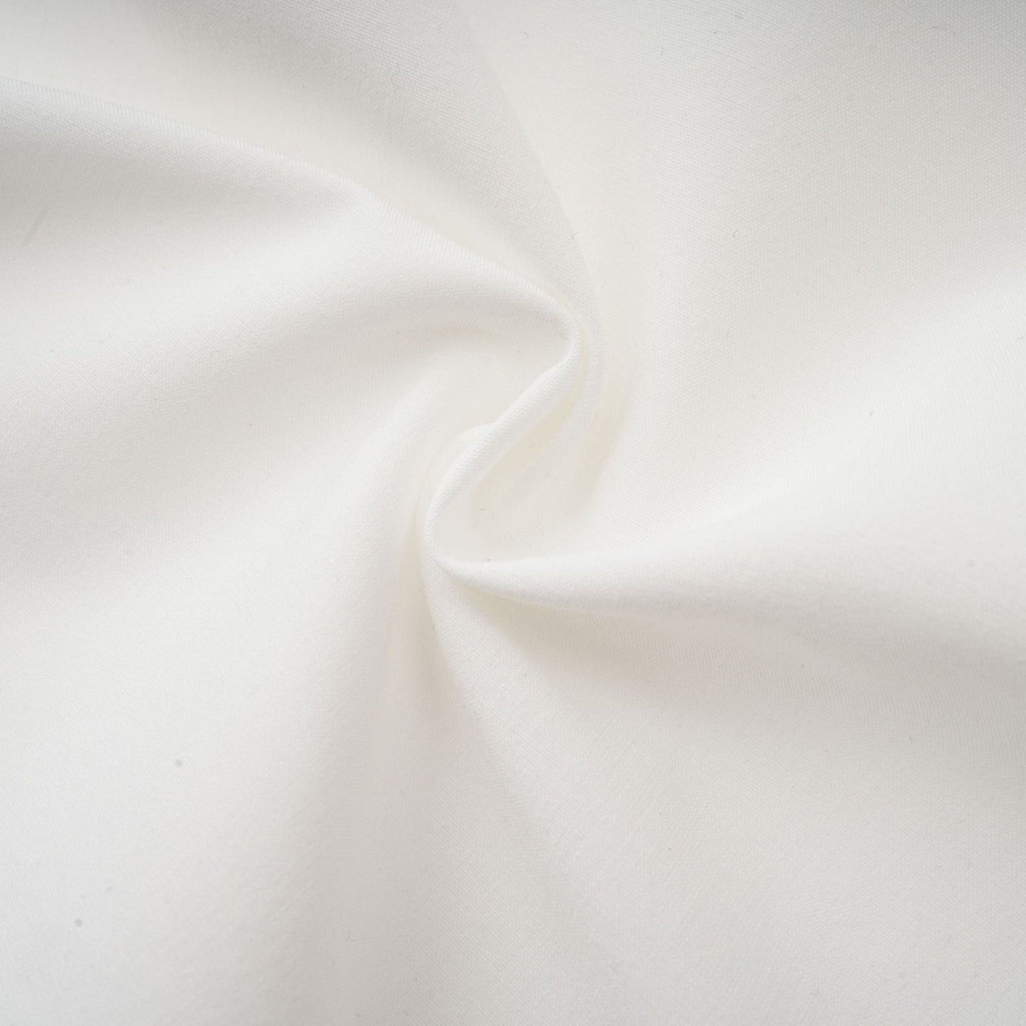 A white midi dress with panelled design and embroidery details named Madeleine featuring a simple elegant silhouette