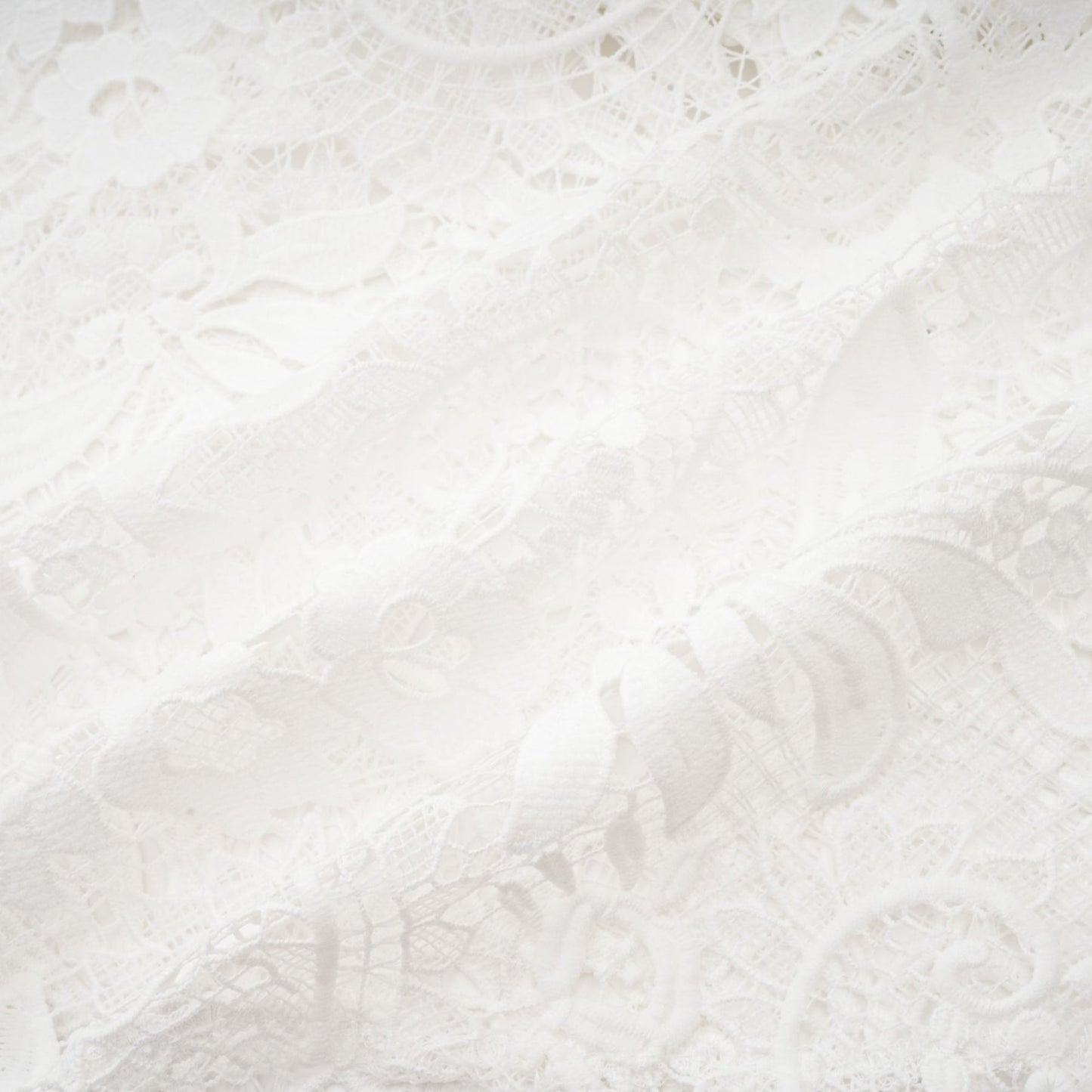 White Aline dress with crew neck long sleeves and embroidered lace detail Cutout design cinch waist flounce hem front button closure and composed of cotton terylene and viscose
