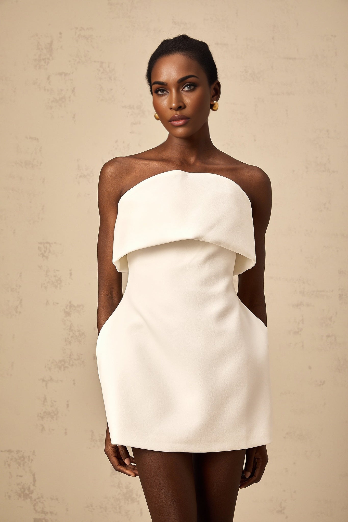 A white offshoulder mini dress with puff sleeves named Enora