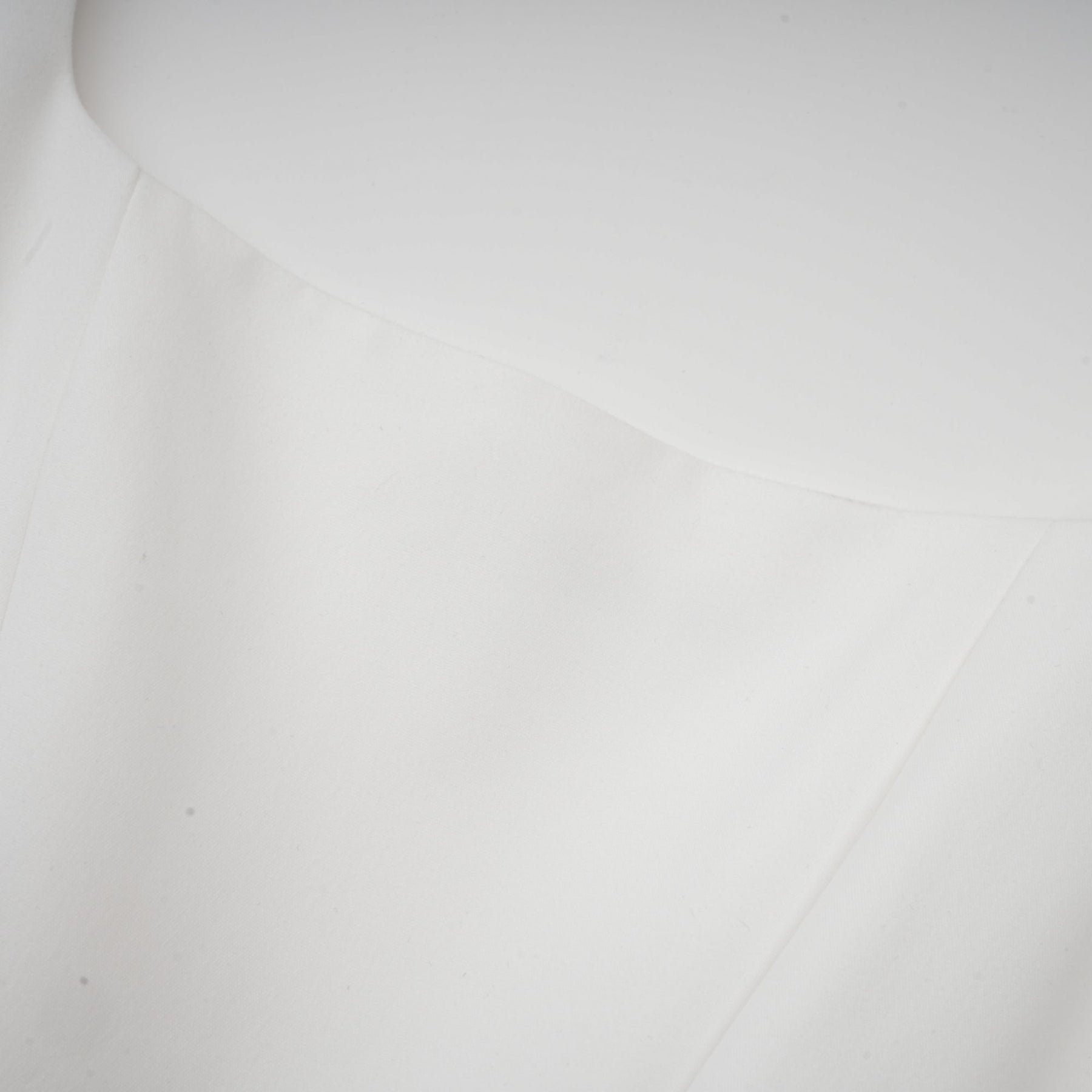 A white pleated corset dress named Sadie on display