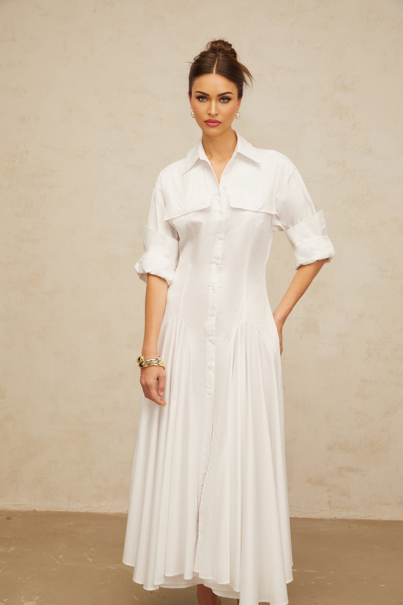 A white shirt dress with a front slit and shirred detailing named Dulcie