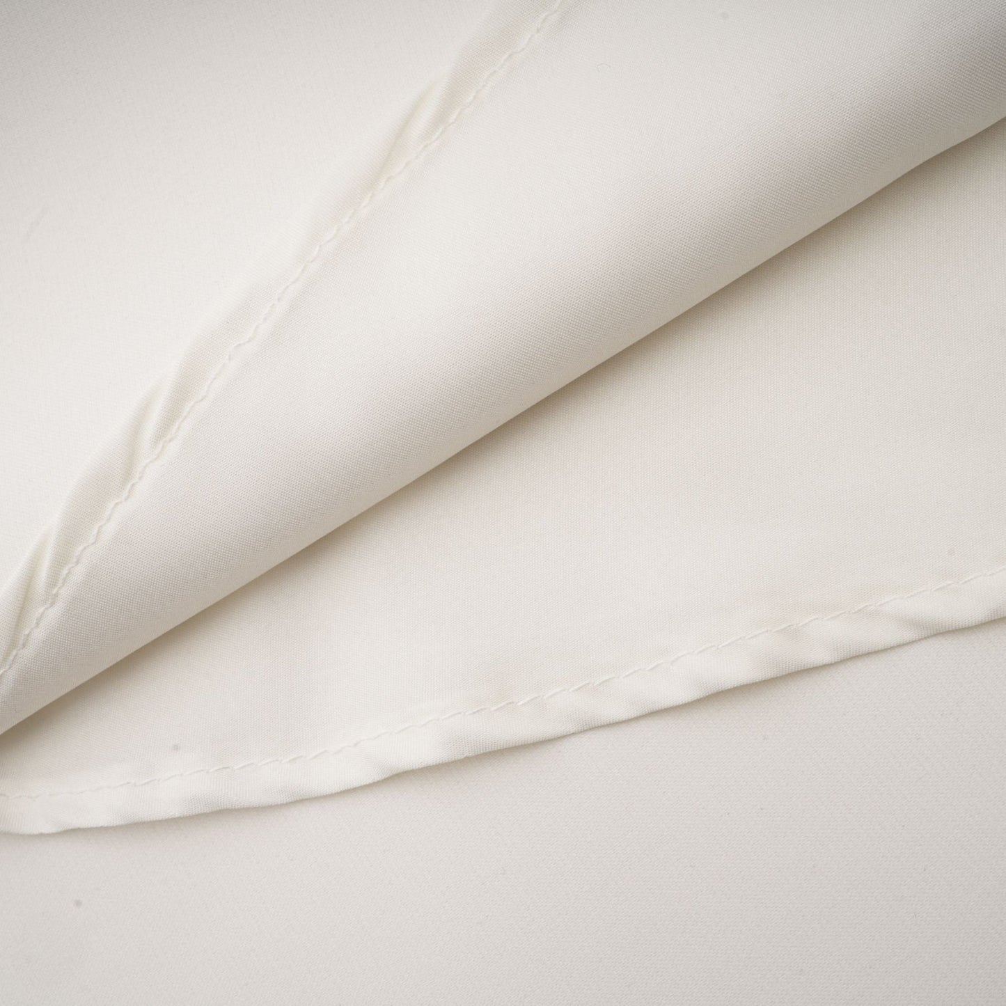 A white sleeveless midi dress with floral applique details named Emilie