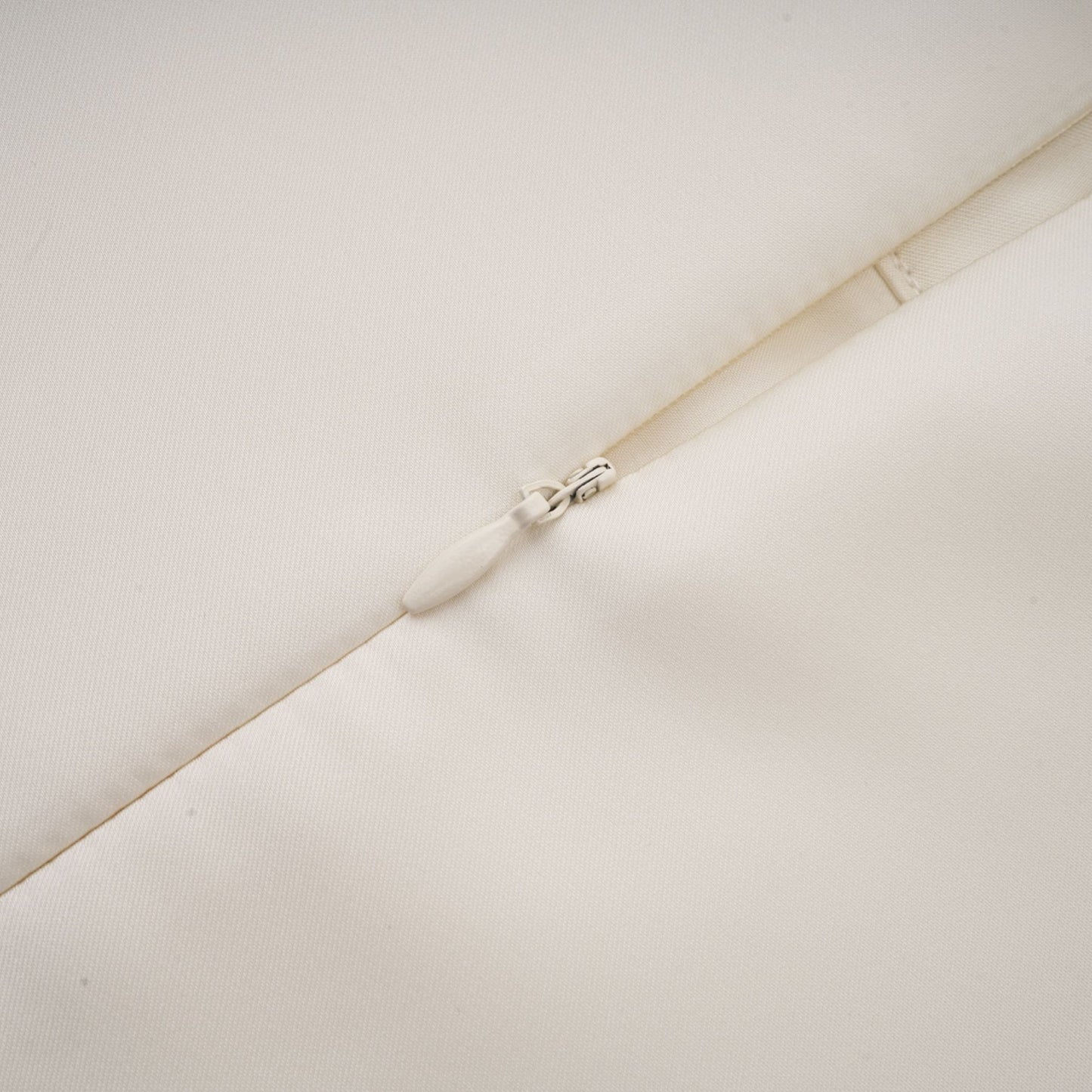 A white sleeveless midi dress with floral applique details named Emilie