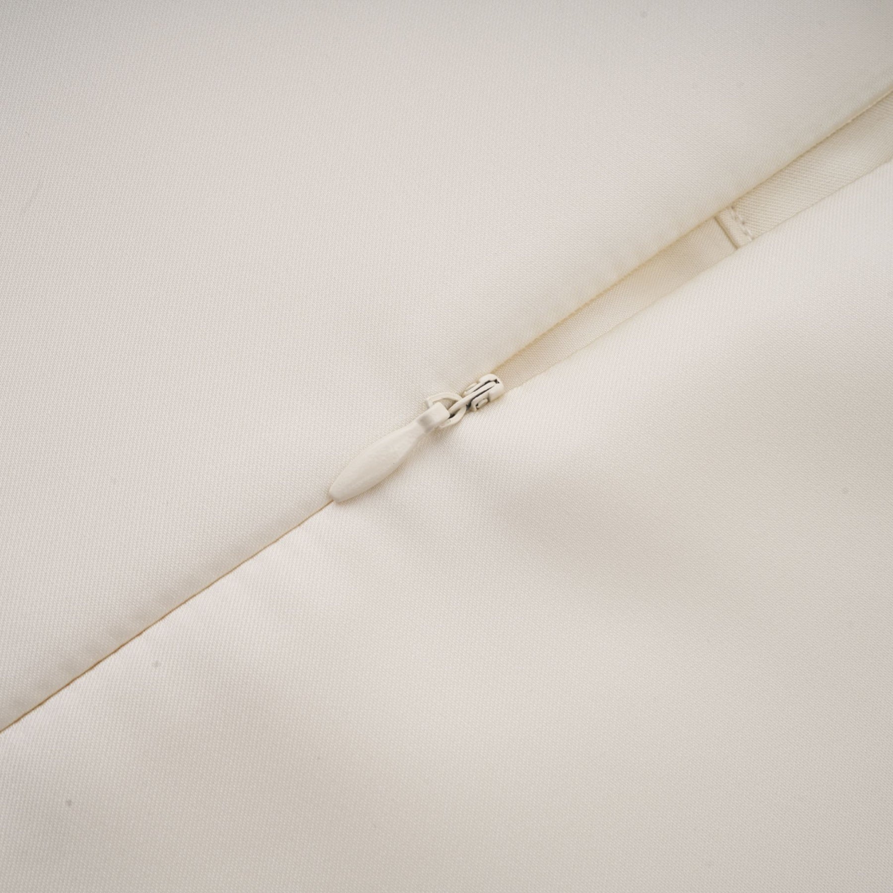 A white sleeveless midi dress with floral applique details named Emilie