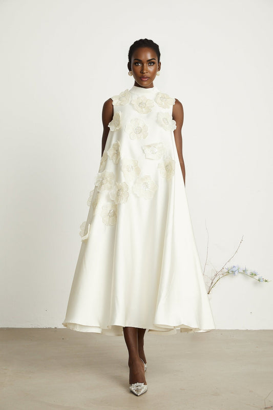 A white sleeveless midi dress with floral appliques called Emilie