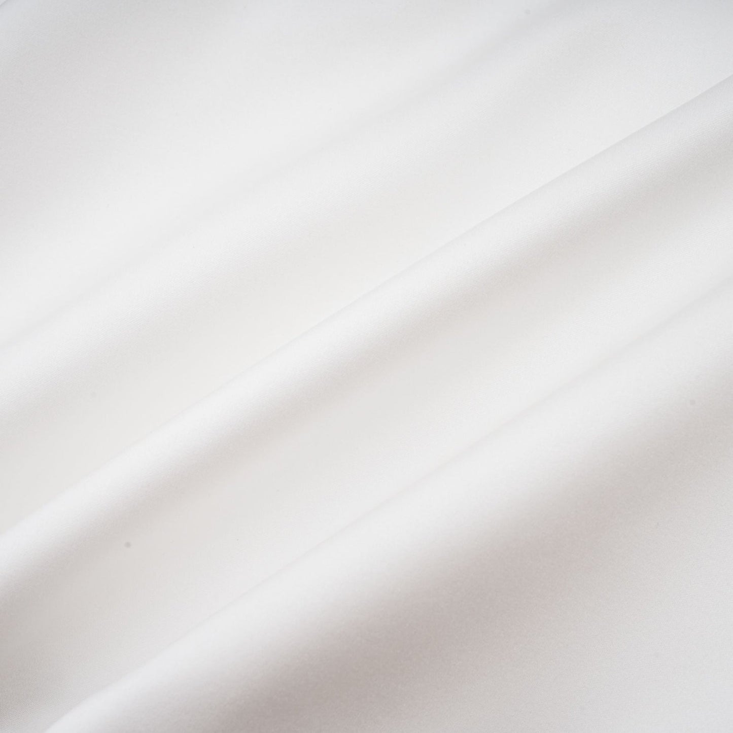 A white strapless mini dress with a corsetstyle bodice adorned with floral petal details named Lucie