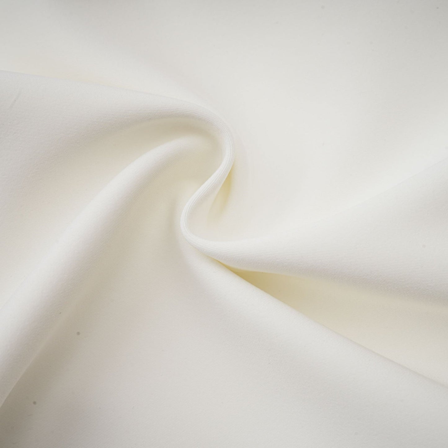 A white twopiece outfit featuring a top and skirt adorned with crystal embellishments named Jeanne matching set