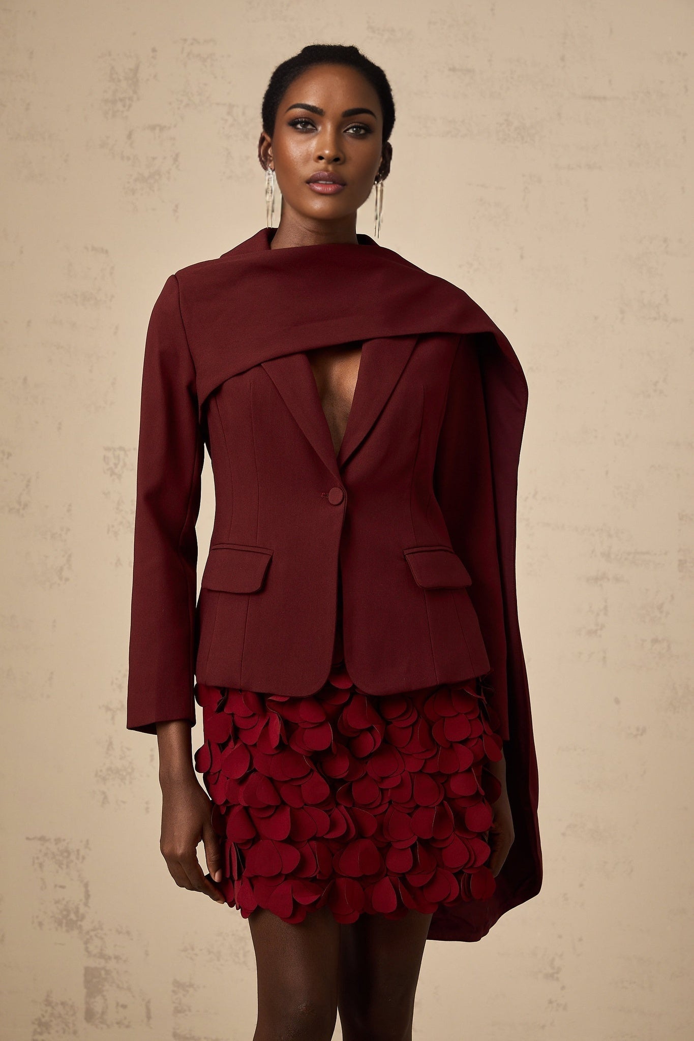 A winecolored jacket with shawl detailing named Coralie