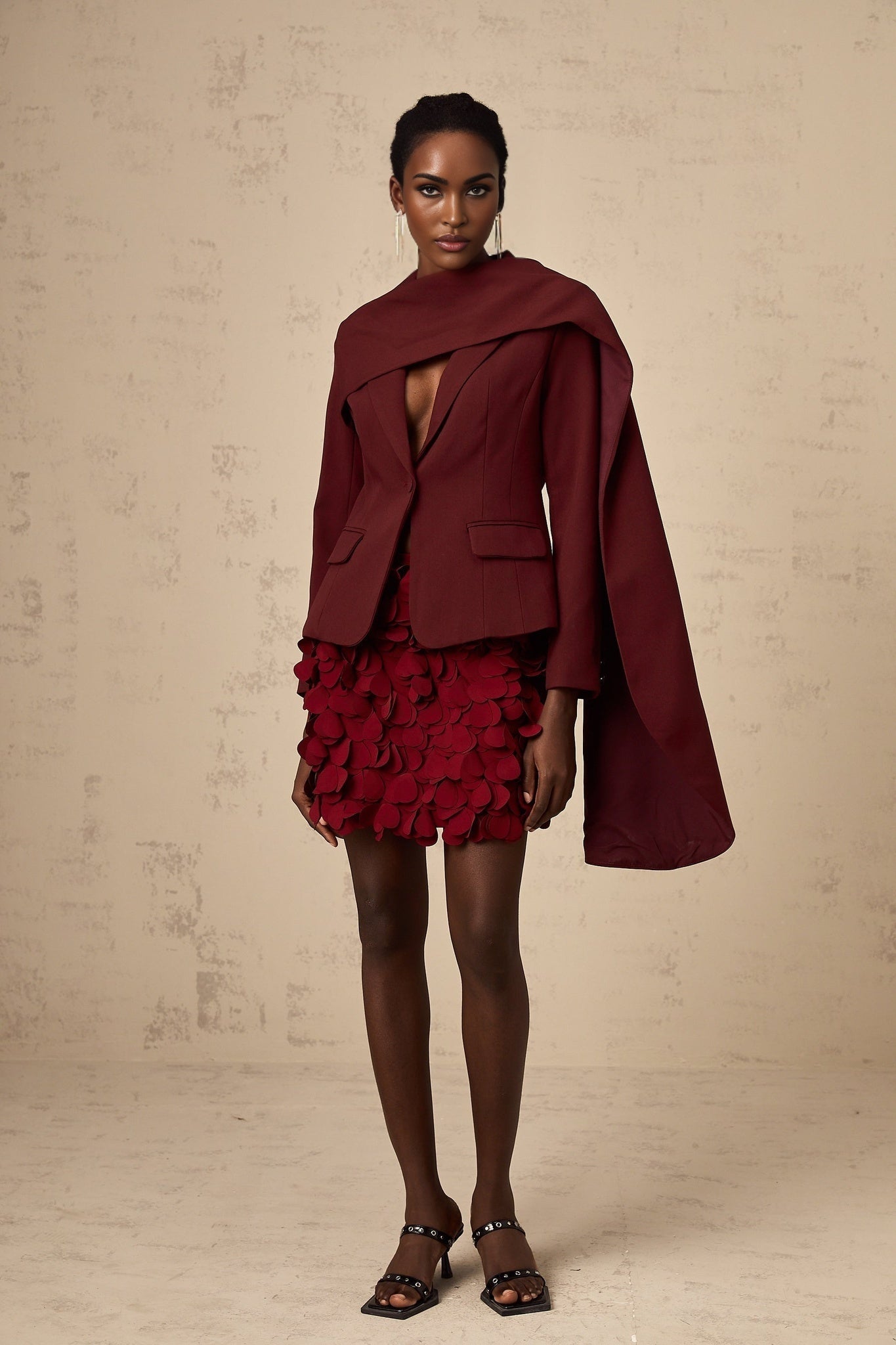 A winecolored jacket with shawl detailing named Coralie