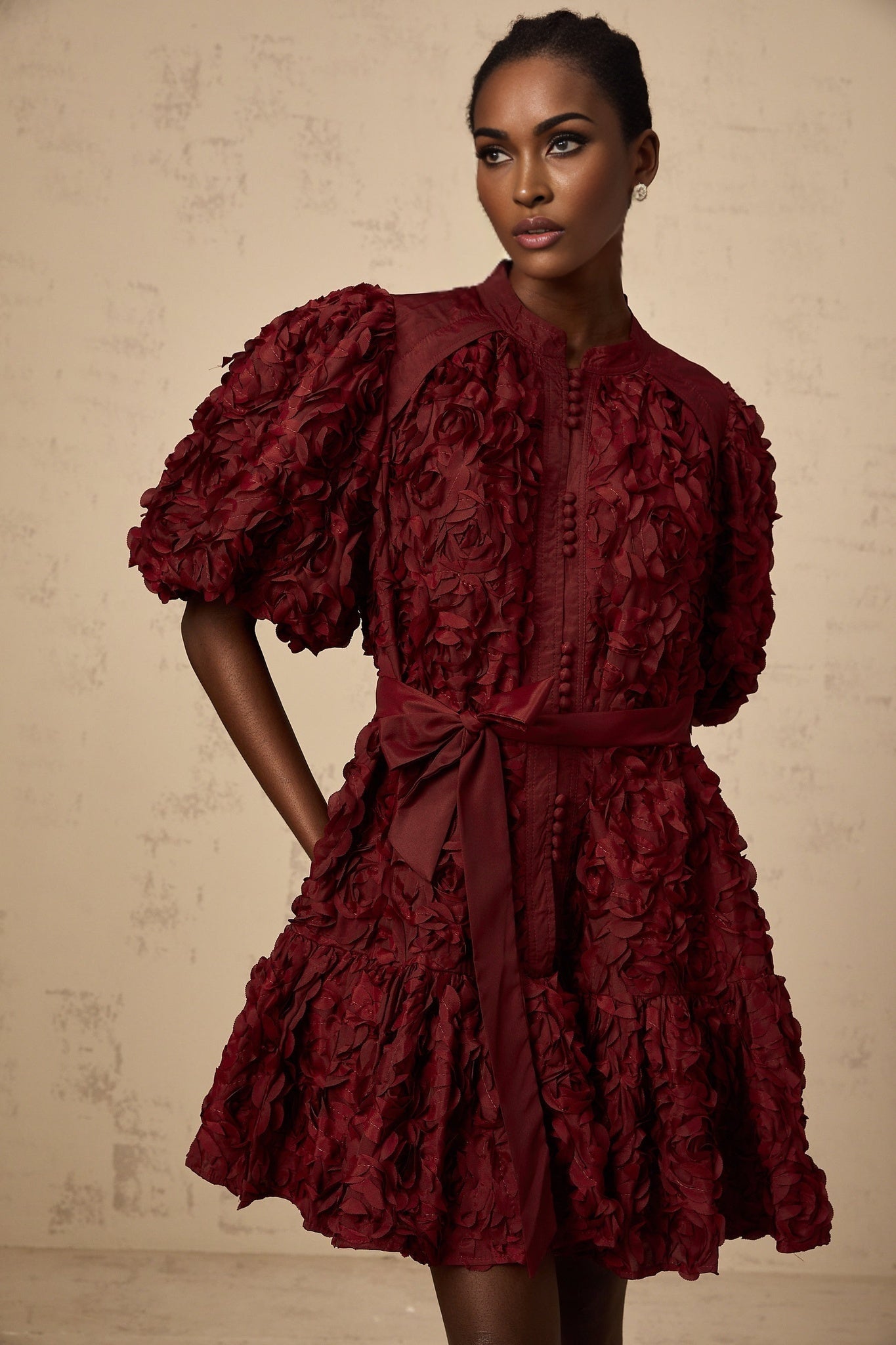 A winered mini dress with 3D petal puff details named Segolene