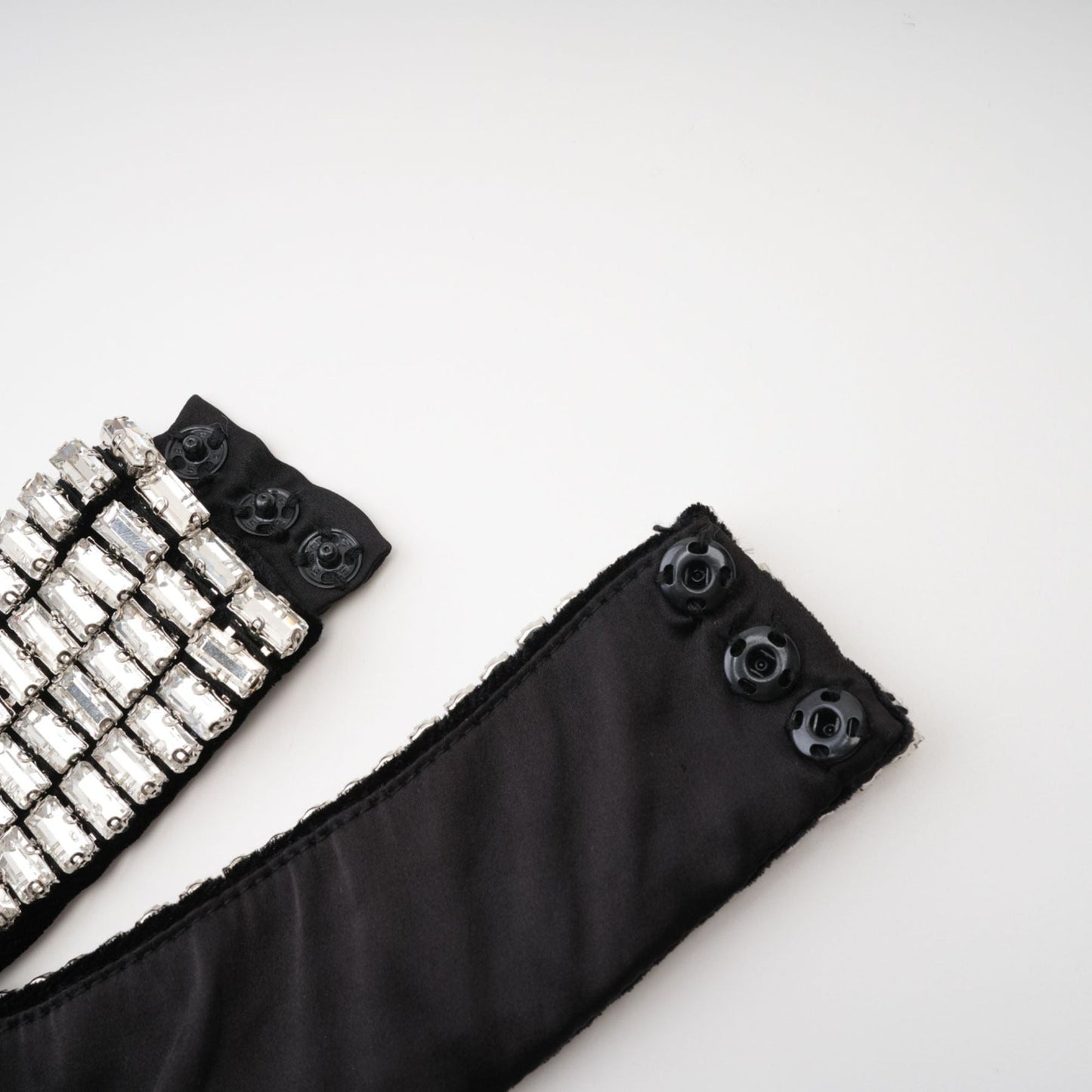 Black anklelength dress with roll neck sleeveless crystaldecorated embellished turtle neck rear zip fastening side slit made of 100% Polyester