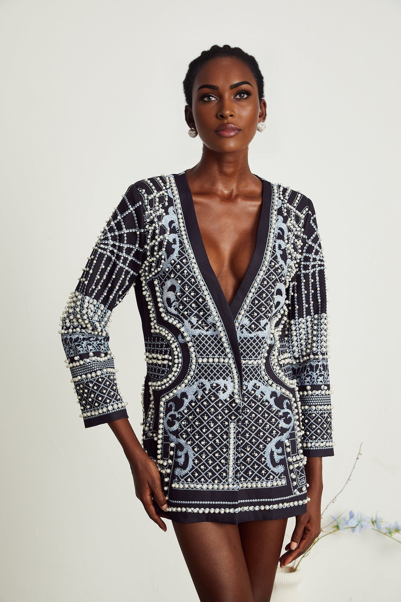A woman wearing a blazer dress with a Catherine pattern print and Vneck design