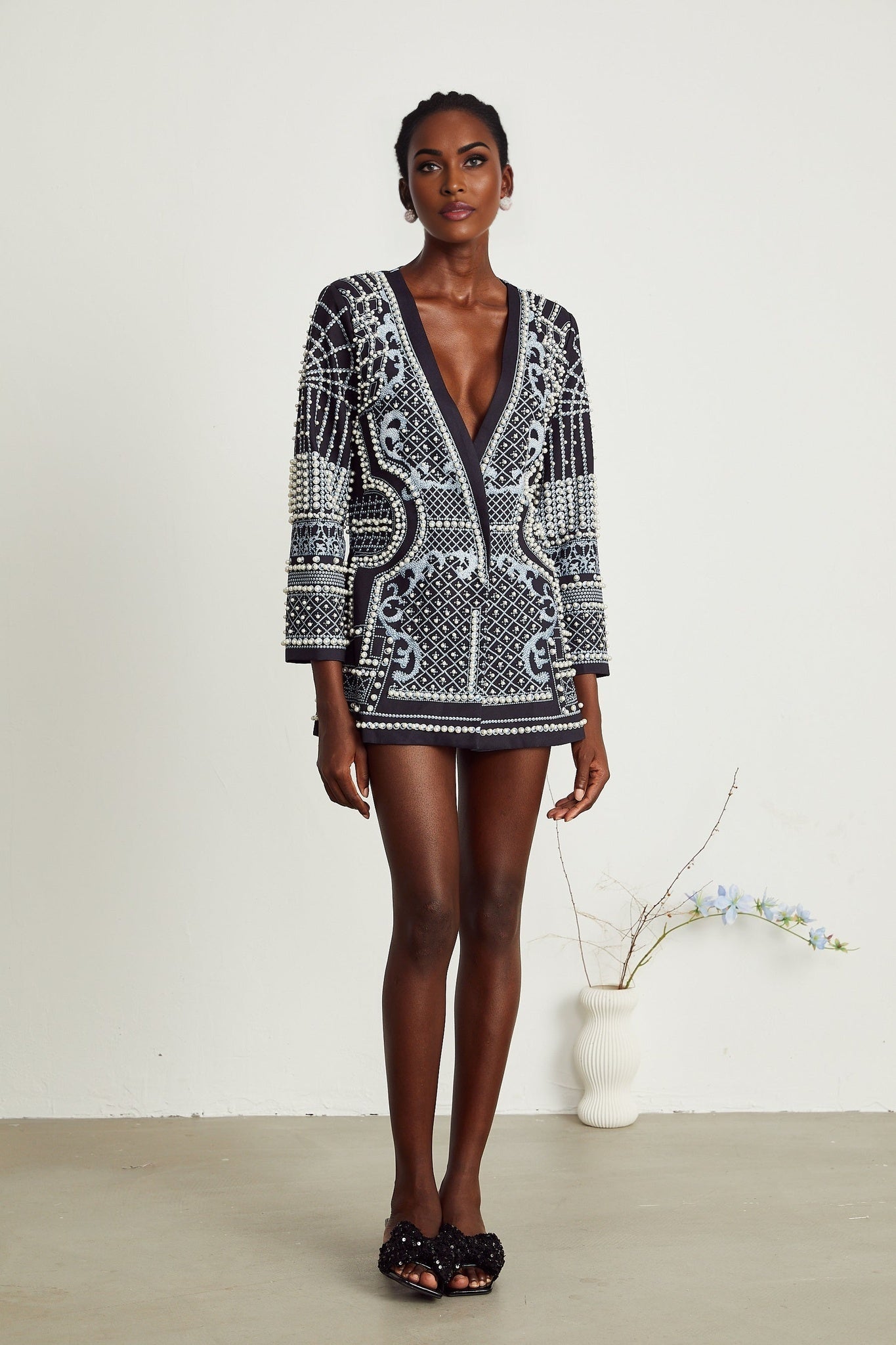 A woman wearing a blazer dress with a Catherine pattern print and Vneck design
