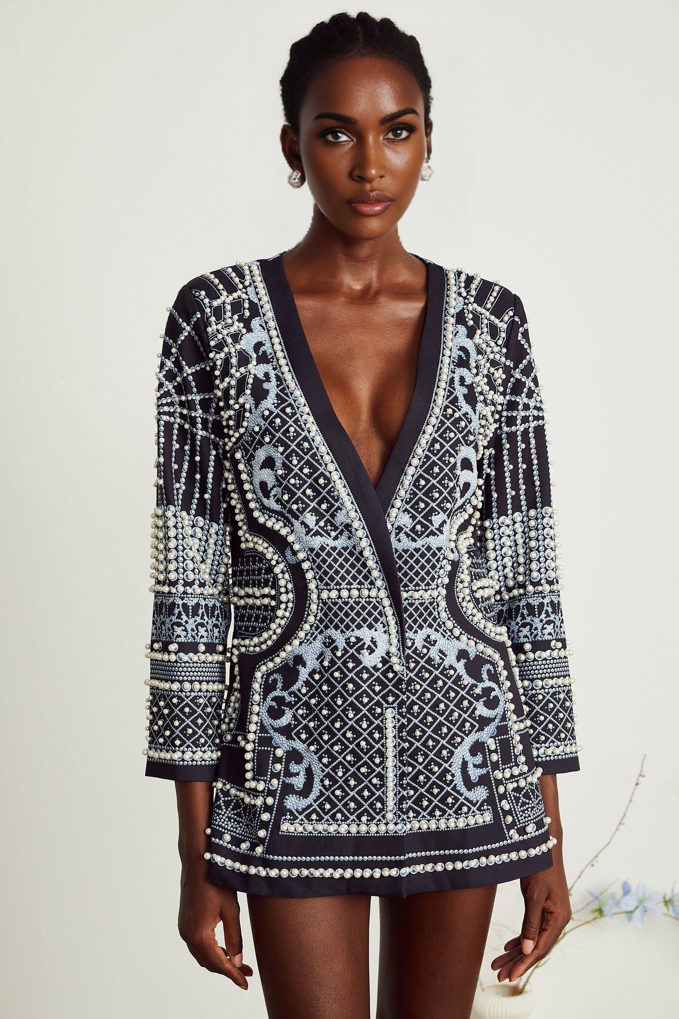 A woman wearing a blazer dress with a Catherine pattern print and Vneck design