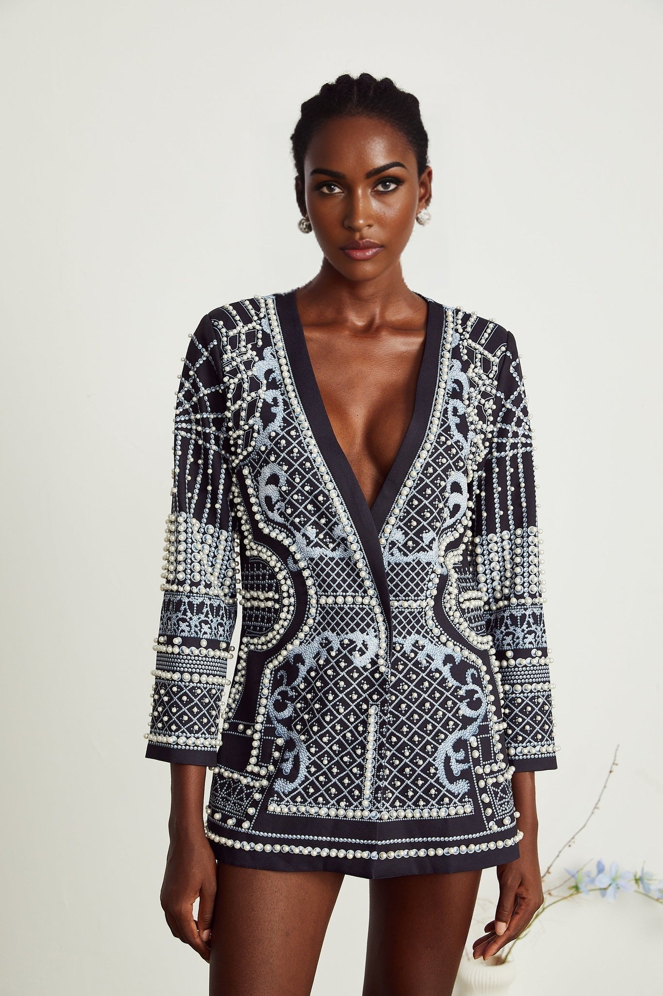 A woman wearing a blazer dress with a Vneck and Catherine pattern print