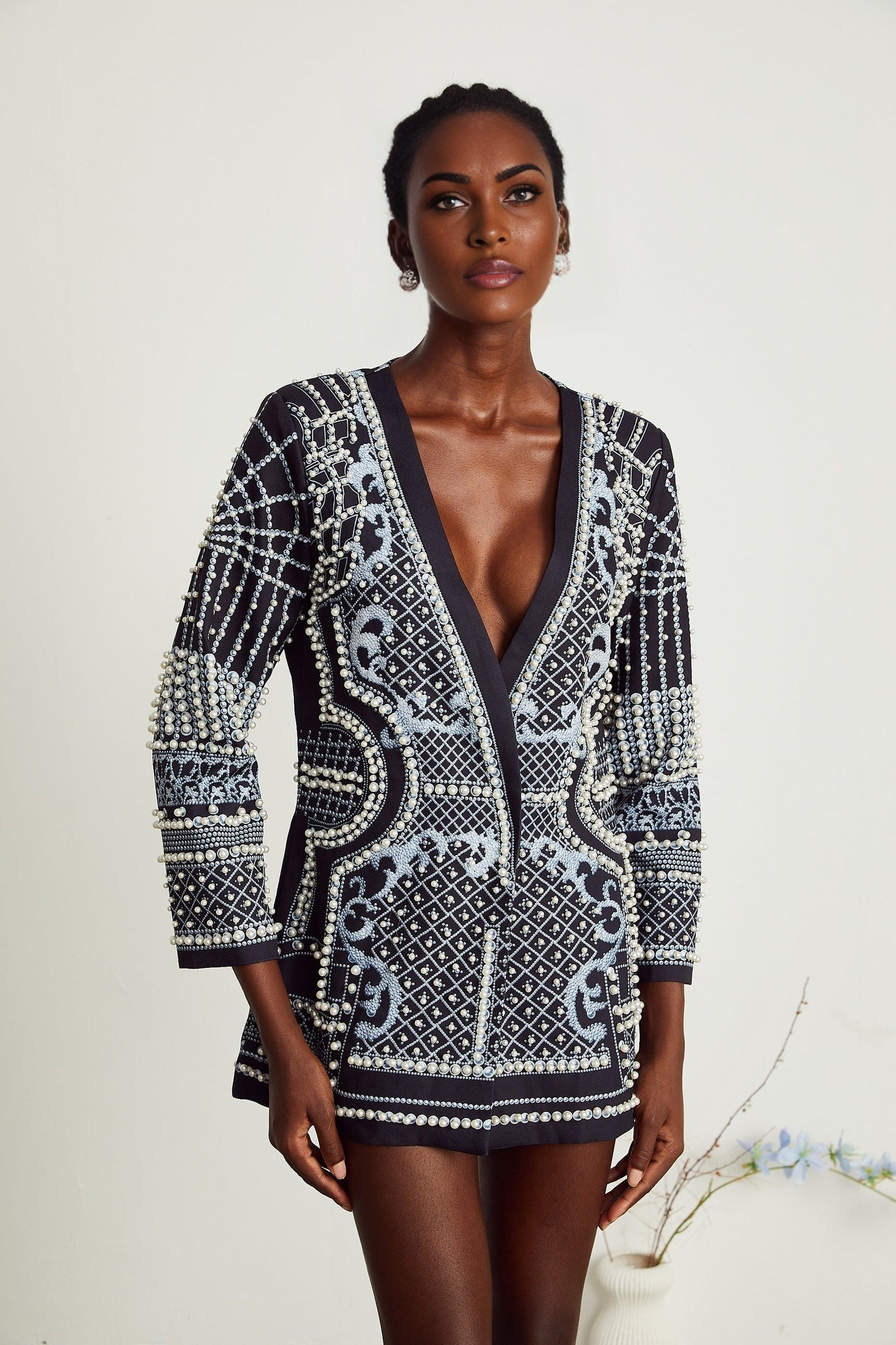 A woman wearing a blazer dress with a Vneck and Catherine pattern print