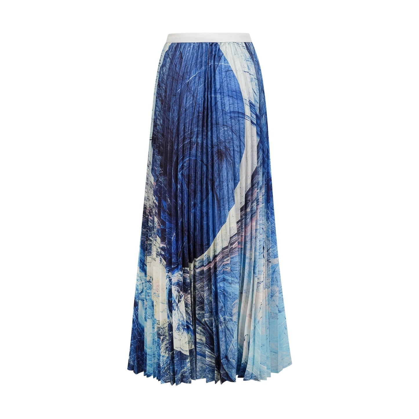A woman wearing a blue patterned cape and matching skirt set The cape features a creased design and drapes over the shoulders The skirt is knee length Both pieces have an allover blue pattern print