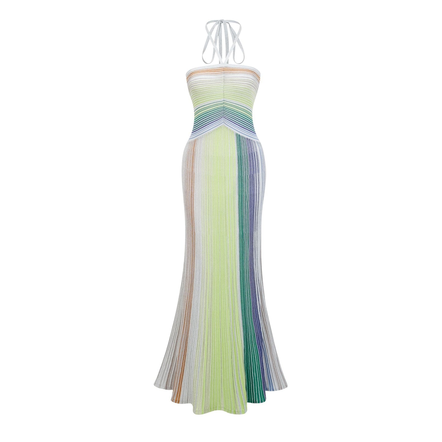 A woman wearing a long metallic knit backless maxi dress with a shimmering finish standing in an elegant pose