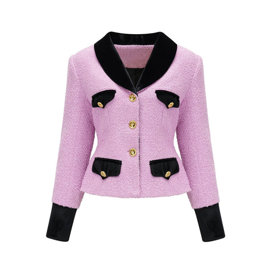 A woman wearing a matching blazer and skirt set in a professional style