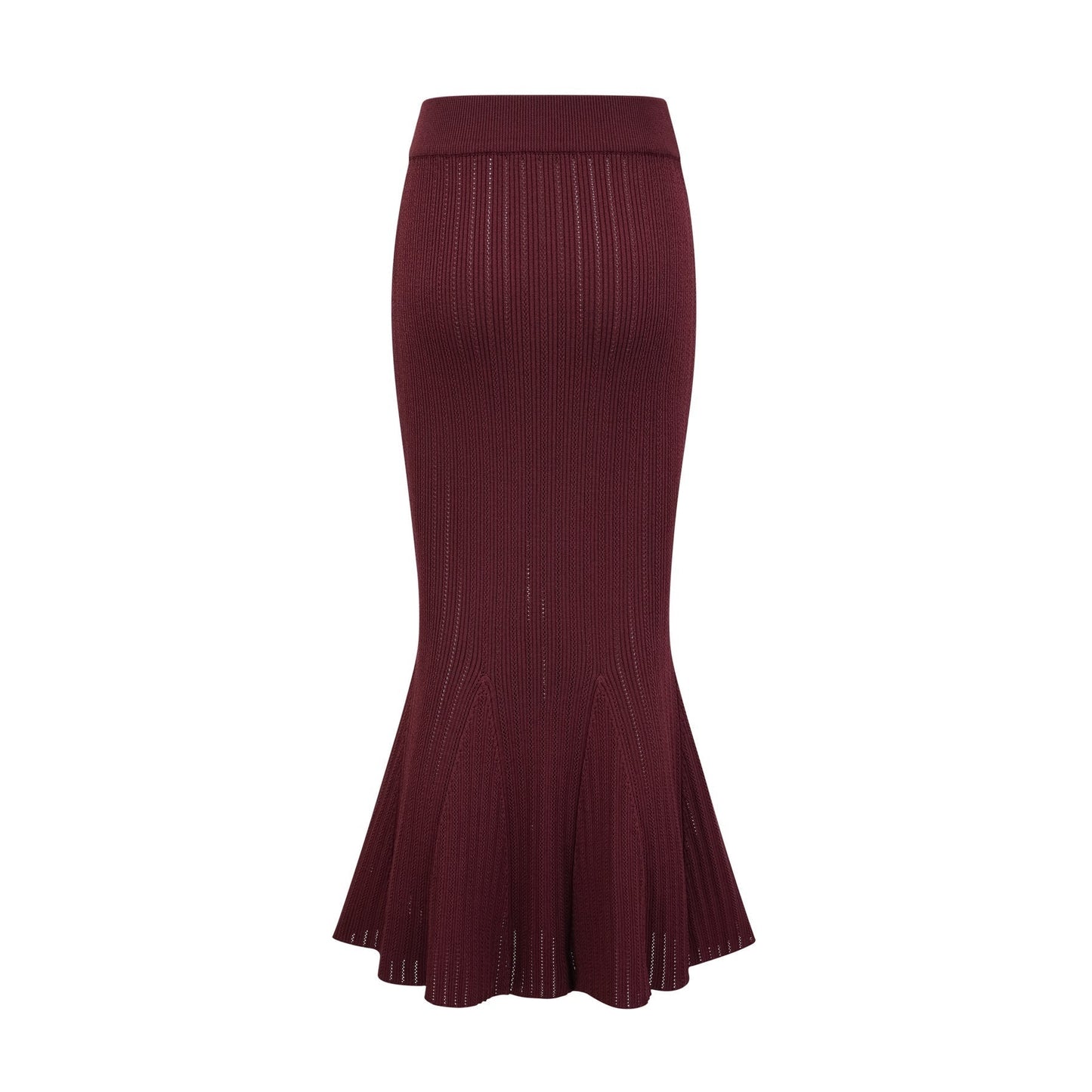 A woman wearing a matching red knit outfit consisting of a ruffled top and skirt The top has short sleeves and the skirt falls to mid thigh length The set is called Corrine and has a vibrant red color