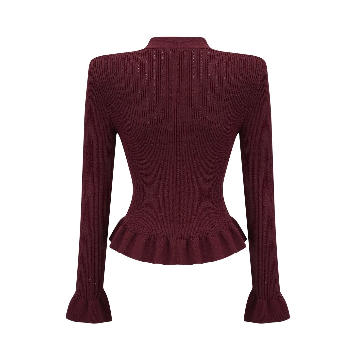 A woman wearing a matching red knit set consisting of a ruffled top and skirt The top features short sleeves and ruffled details while the skirt has a fitted silhouette Both pieces are in a vibrant red color