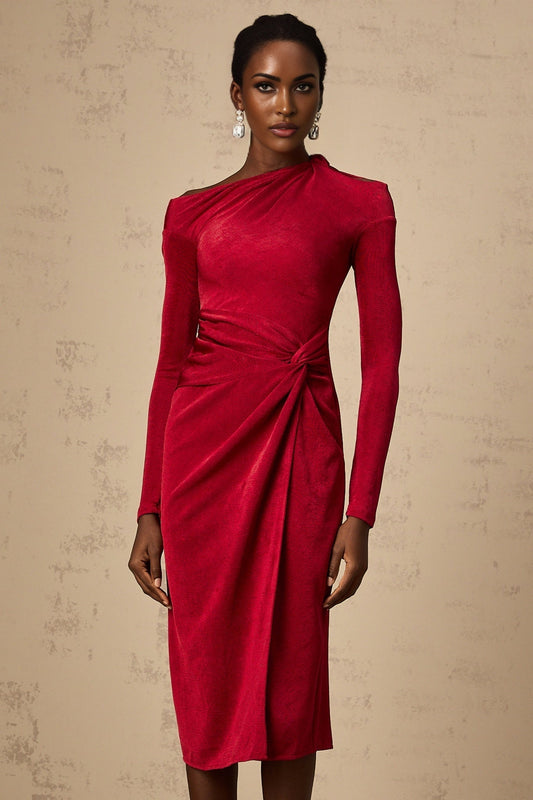 A woman wearing a red midi dress with a high slit and gathered fabric details