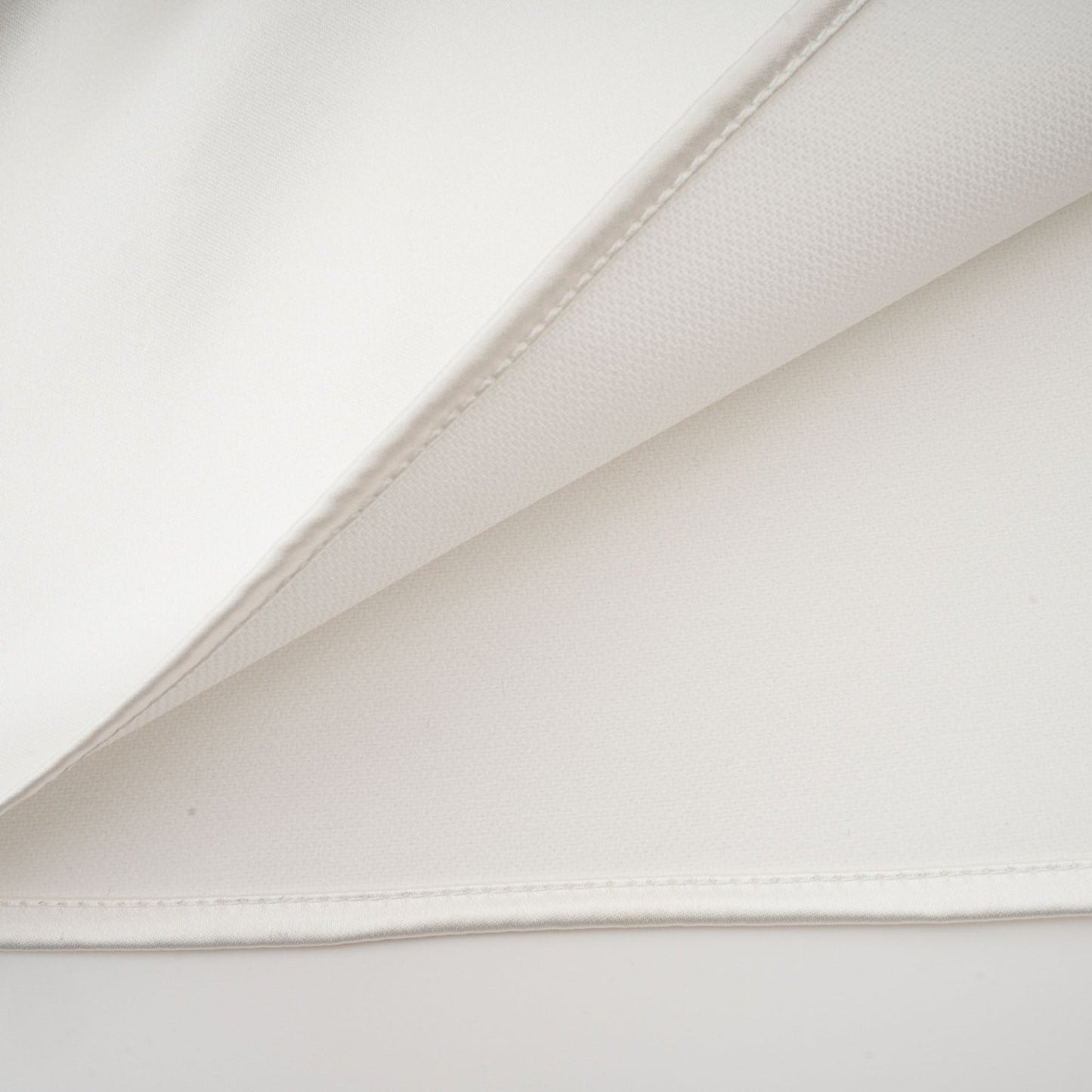 White satin dress with sleeveless design square neck spaghetti straps and asymmetric hem Rear zip fastening and thigh length Composed of 56% Polyester 44% Acetate