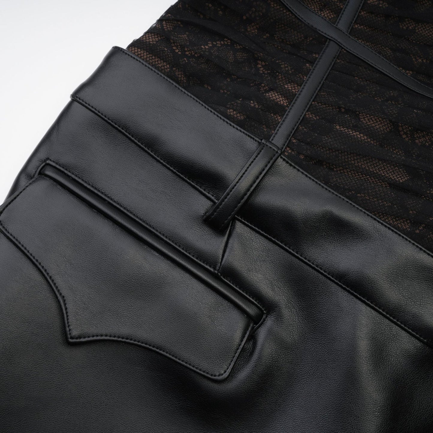 Black bustier style dress with mesh detailing fauxleather finish and asymmetrical design Rear zip fastening and belt loops Made of 75% Polyester 20% Cotton and 5% Spandex