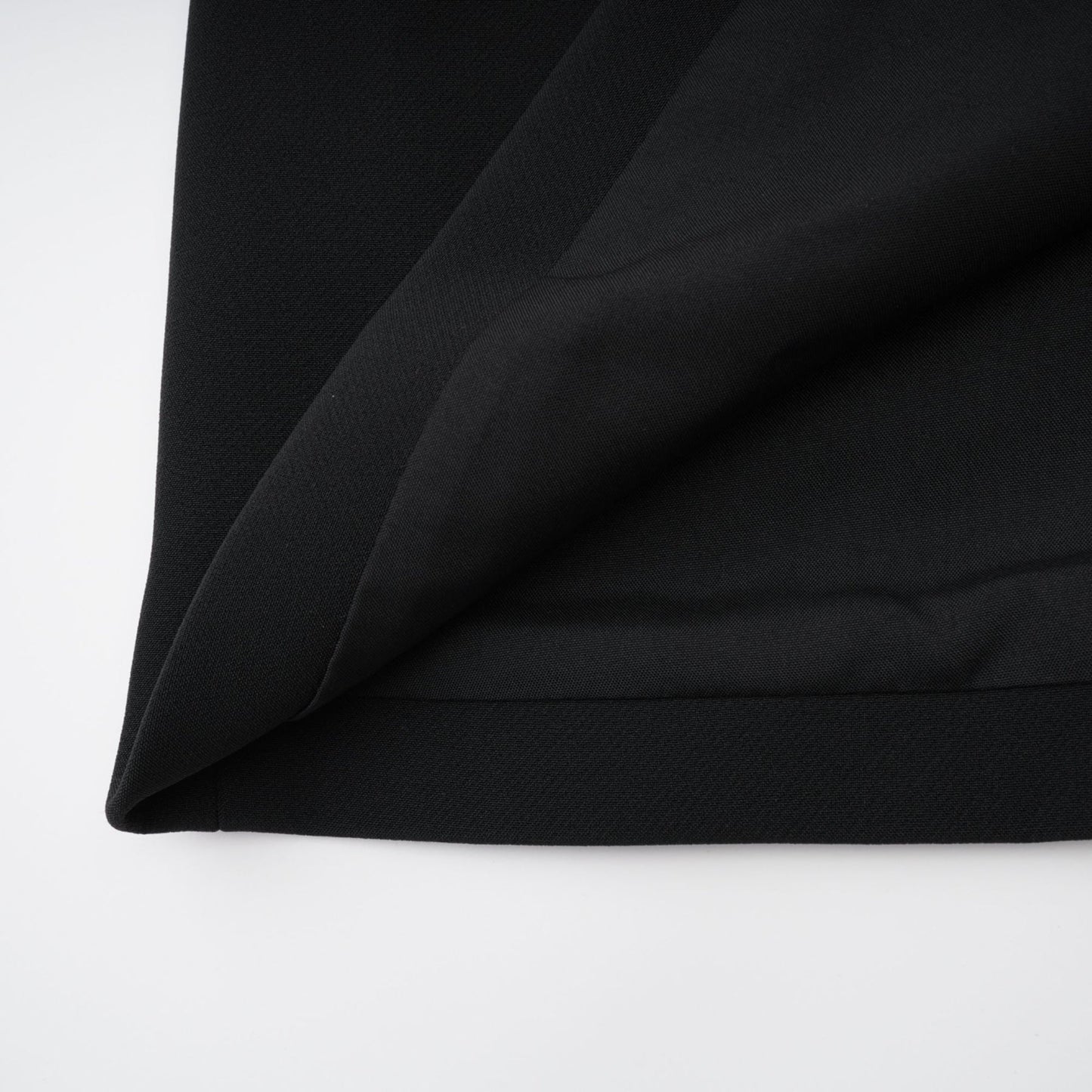 Black wool dress with sleeveless style velvet trim bow detailing low back straight hem thigh length composed of 70% Terylene 22% Viscose 8% Spandex