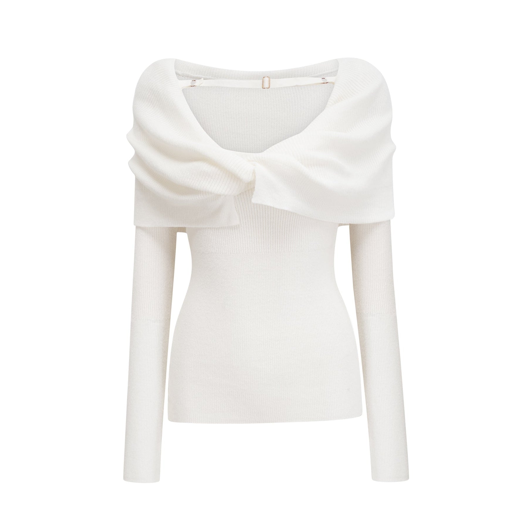 A woman wearing a white knitted offshoulder long sleeve top with a ribbed texture